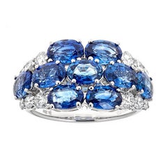 Used Oval Cut Blue Sapphire and Diamond Accent Floral Ring in 18 karat White Gold
