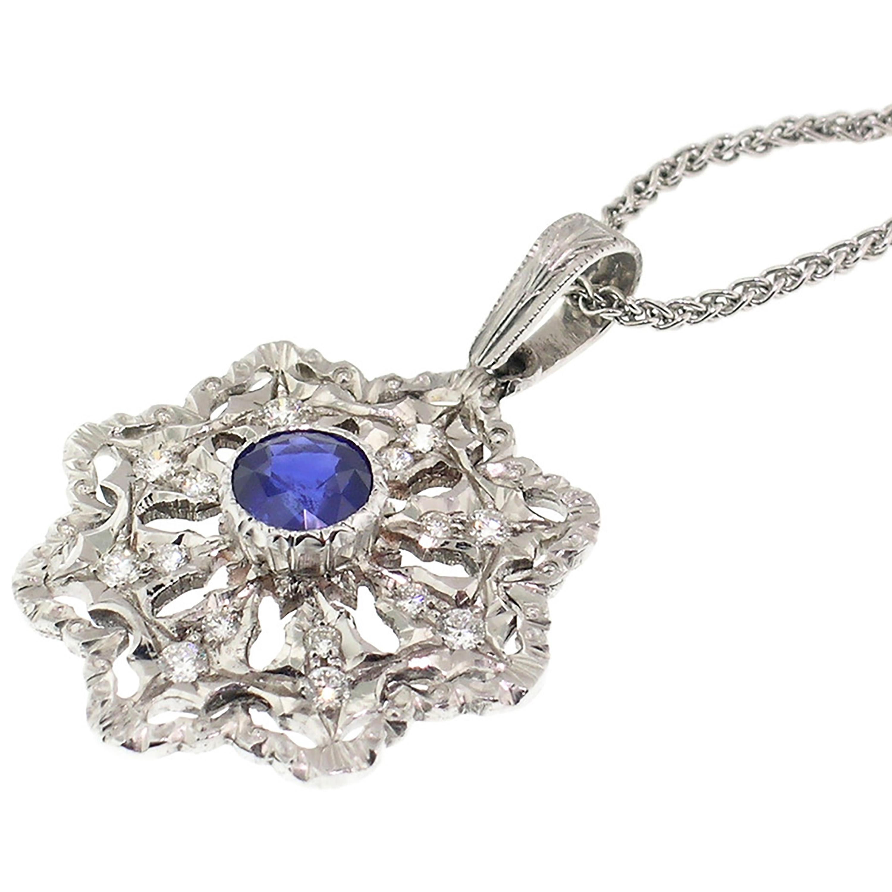 Few things are more classic than a brilliant blue sapphire with diamonds in white gold. This sapphire features a perfect blue color and has been cut to maximize its lively and bright look. 

The lovely blue sapphire is centered in an elegant, lacy