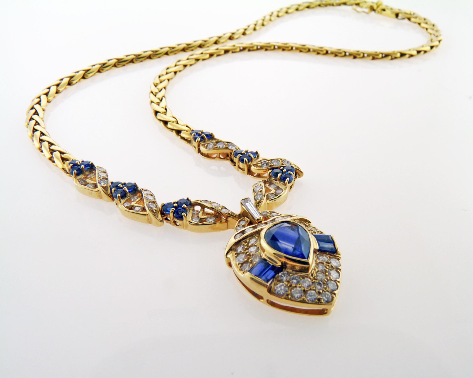 Gorgeous and attractive Pendant is made of pear-shaped, baguette and round-cut Sapphires and rose-cut Diamonds. This necklace is made of 18K yellow gold that contrast the stones and make it looks very bright and lively. This Sapphire pendant could