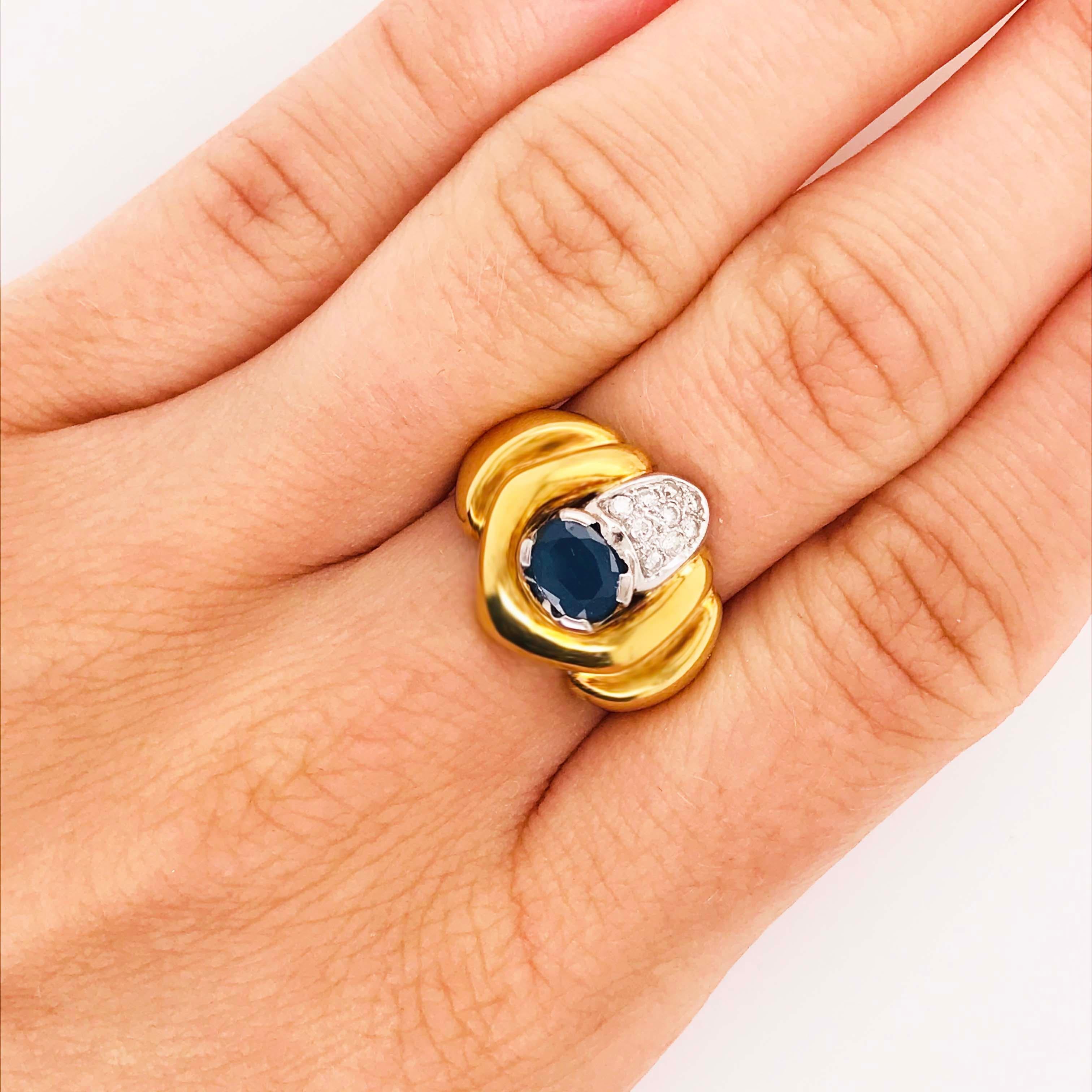This 18 karat yellow gold sapphire and diamond ring is a custom-made, one-of-a-kind ring this is quite striking!  The ring has a very low profile so is excellent if you have to wear gloves or you don't like rings with height.  The design would be