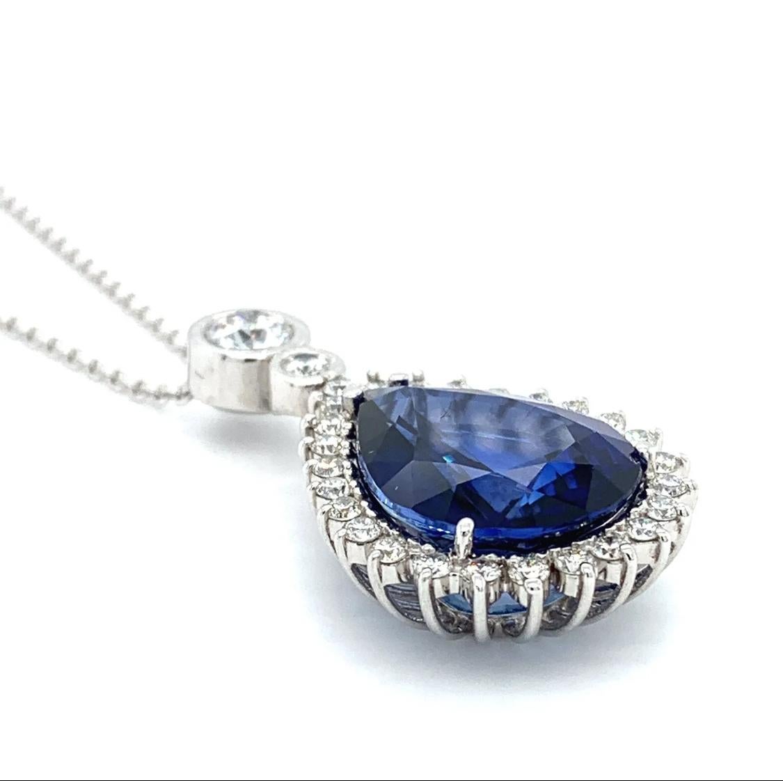 Sapphire and diamond art deco drop necklace 18k white gold
Sapphire and diamond halo cluster around art deco style drop necklace in 18k white gold
Sapphire treated gemstone pear shaped total weight approximately 10.00ct 
Diamonds F colour VS1