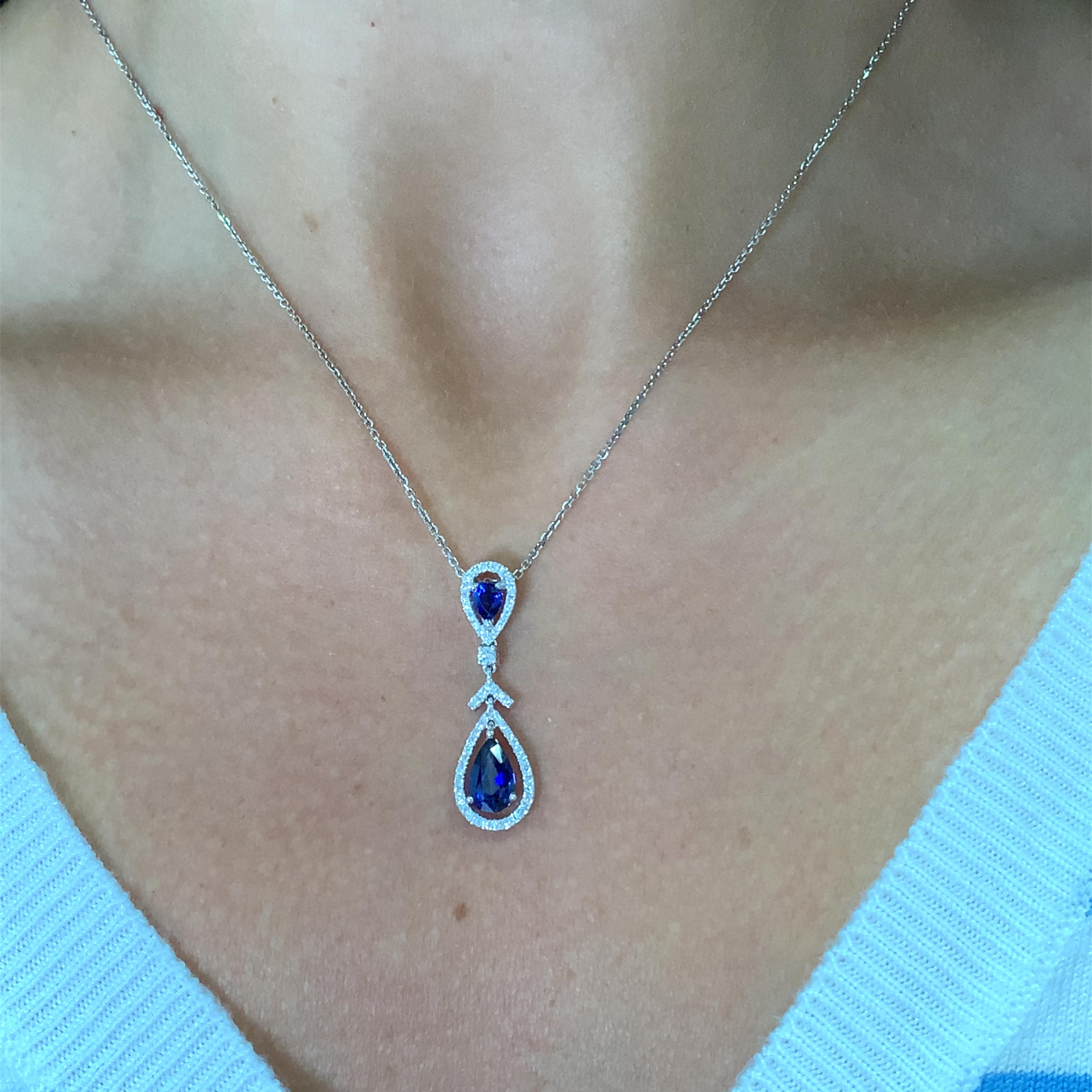 1.9ct Pear Sapphire and Diamonds Halo drop evening pendant necklace in 18k gold. 
Sapphire pear shaped natural unheated centre sapphire total weight 1.00ct, small sapphire total weight 0.25ct. 
Large chunky necklace with pear shaped sapphire blue