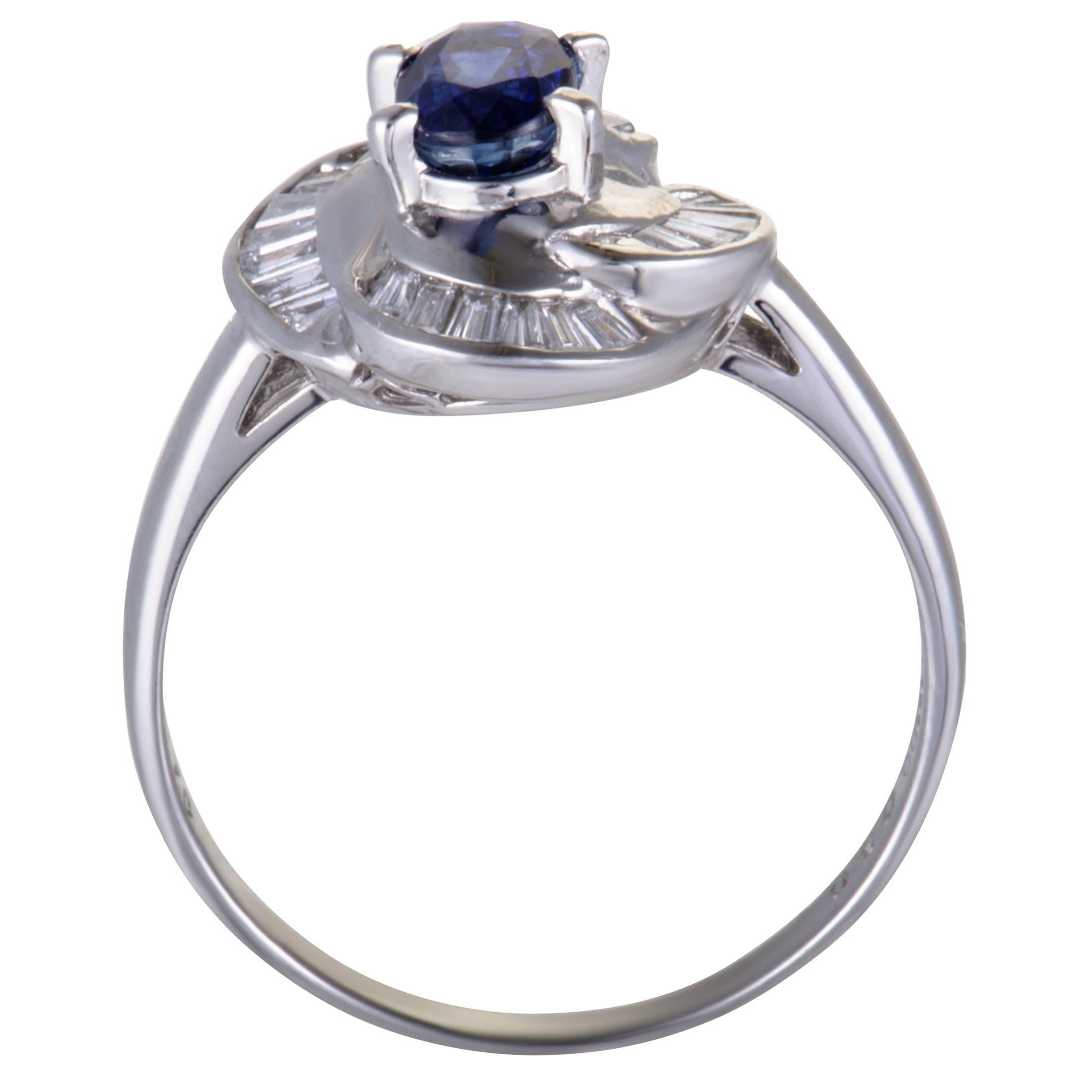 Designed in an endearingly graceful manner, this sublime ring offers an exceptionally classy and elegant appearance. Made of platinum, the ring is set with 0.30 carats of diamonds, while the central place is taken by a captivating sapphire that