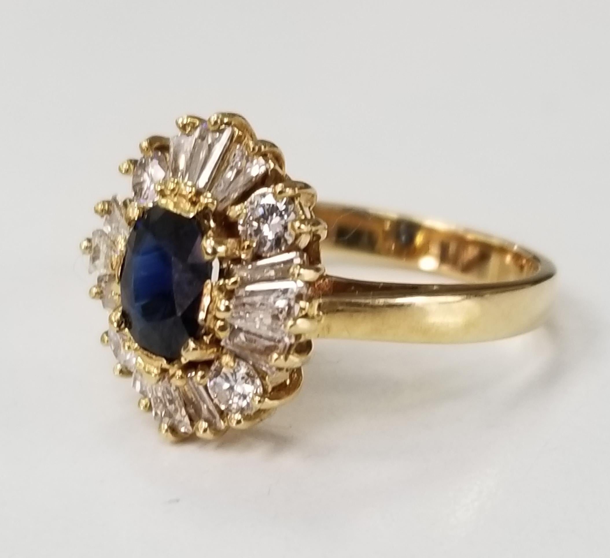 14l yellow gold sapphire and diamond ring, containing 1 oval sapphire of gem quality weighing 1.00cts. and 4 round diamonds weighing .30pts. and 12 baguette cut diamonds weighing .56pts.  This ring is a size 5.5 but we will size to fit for free.