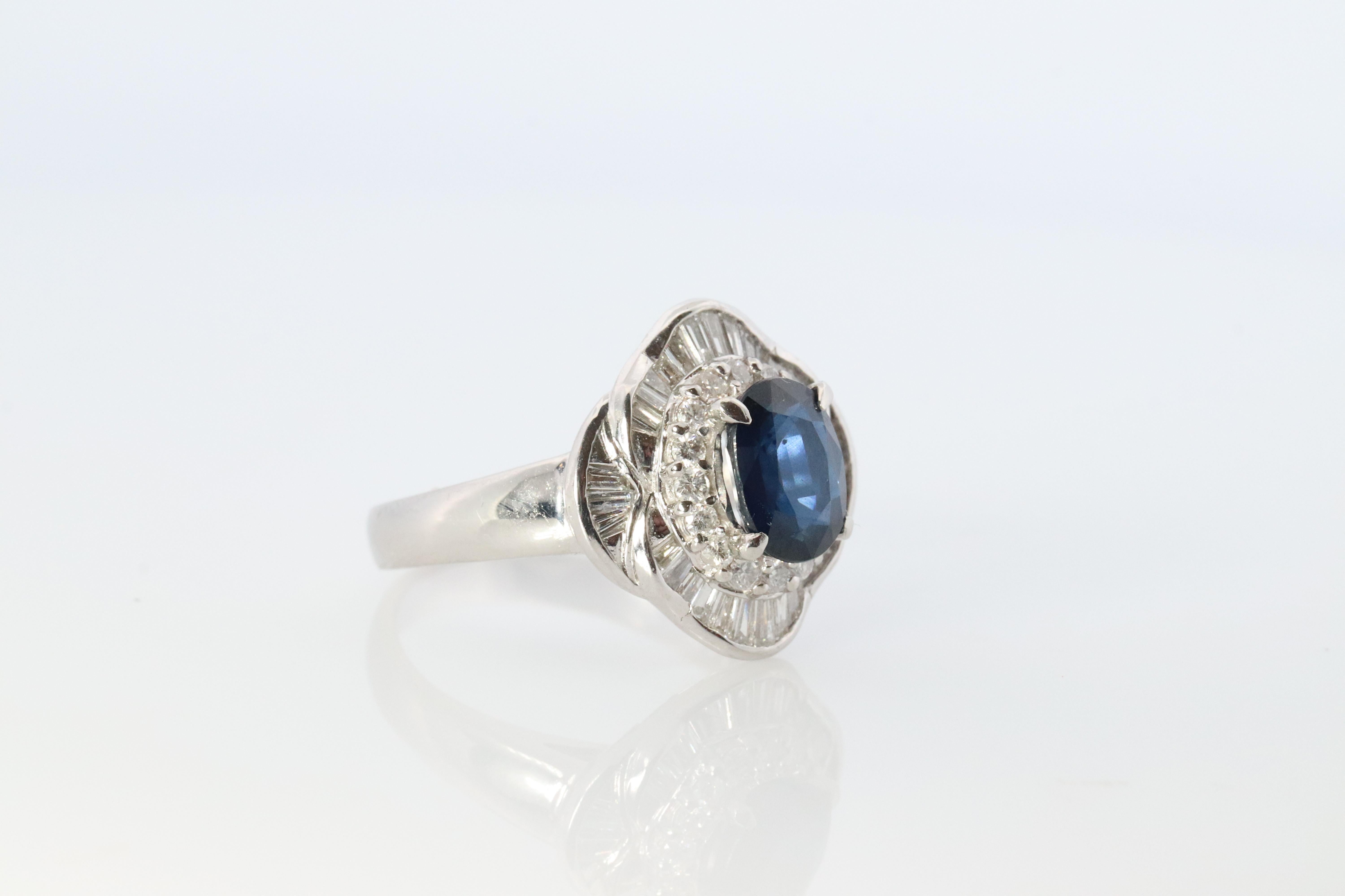 Beautiful Ballerina Ring. Blue center Sapphire. Cut in a oval faceted design. Surrounded by diamonds. Stunning.

Appraised at $6500 Replacement Value. Appraisal included.

Condition: Excellent

Details:
Natural Sapphire 1.06ct
0.68ctw