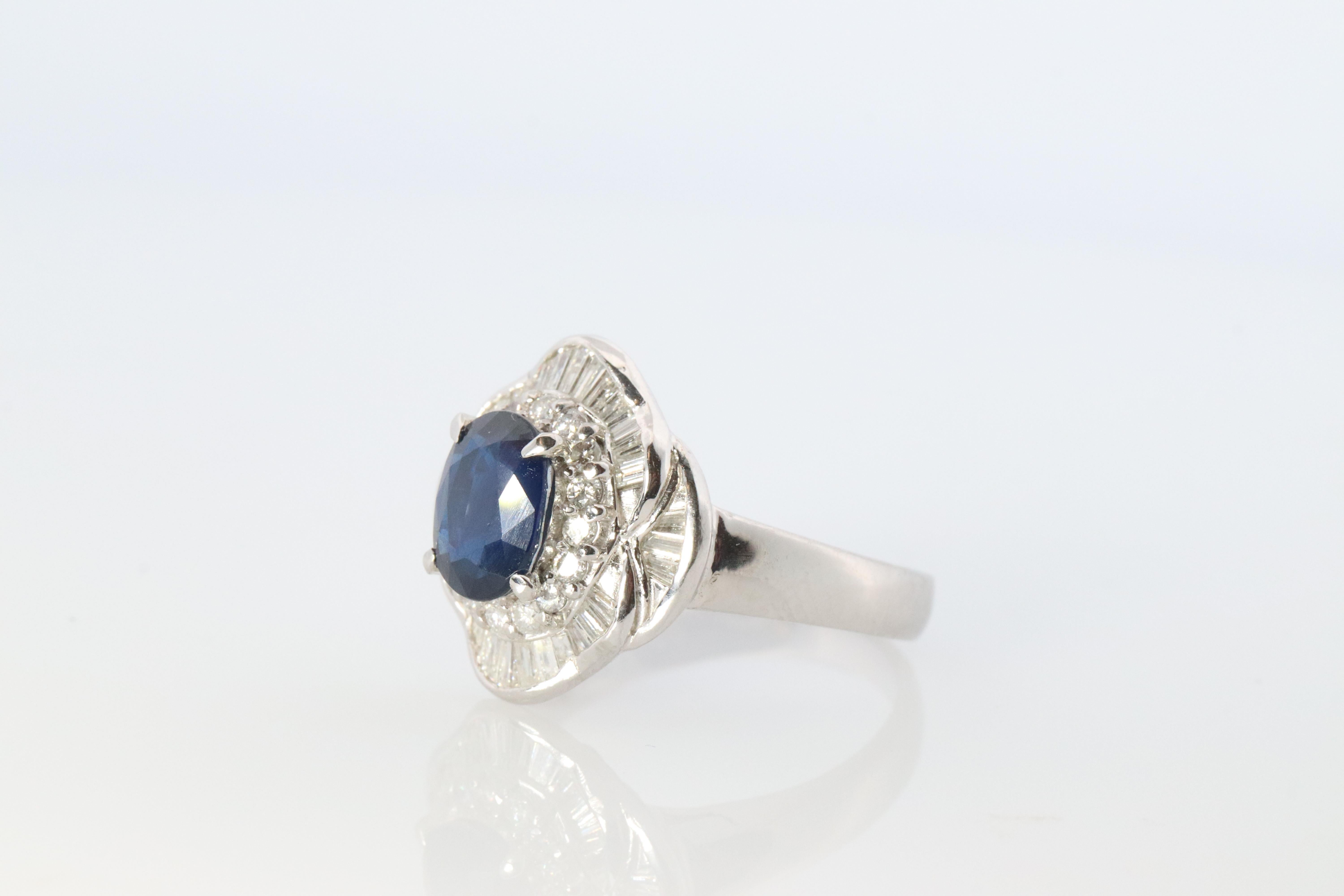 Sapphire and diamond Ballerina ring. Platinum Blue natural sapphire HALO ring In Good Condition In Port Charlotte, FL