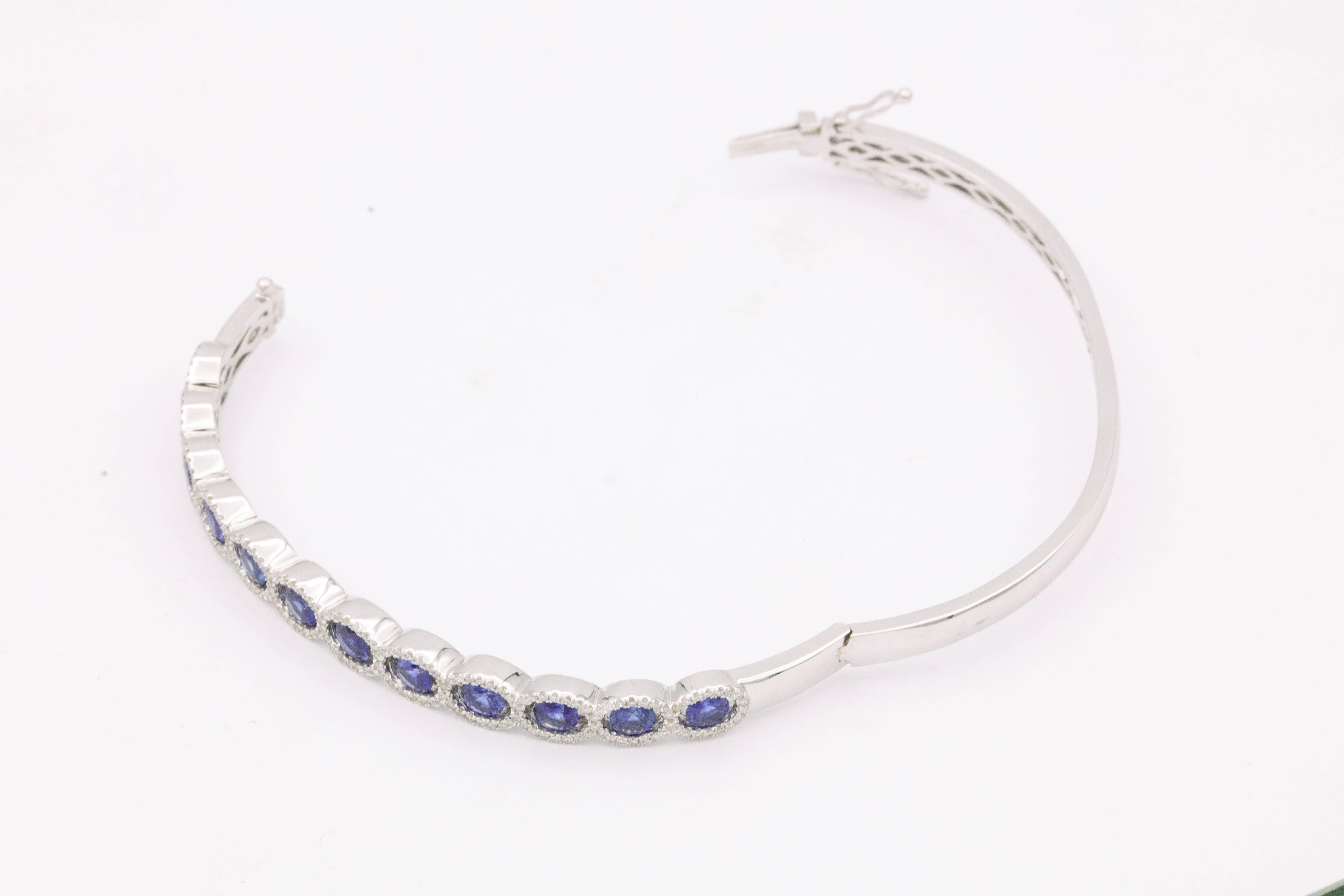 18K white gold
12 Sapphire 2.09 cts. total weight
191 Diamonds 0.52 cts. total weight
11.5 g.
6 cm wide