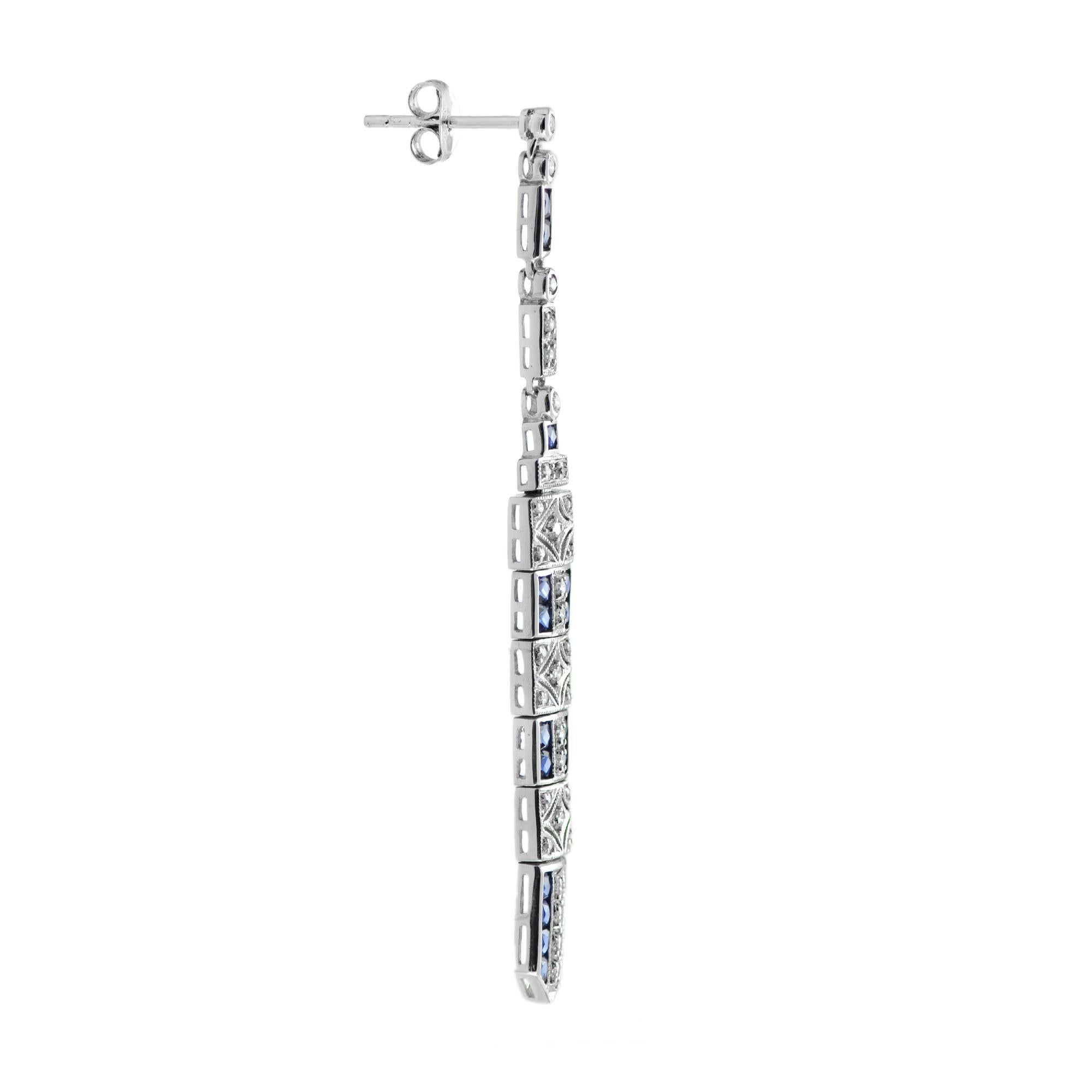 These art deco bar dangle earrings are the epitome of vintage inspired elegance featuring mesmerizing geometric patterns feature with sapphire and diamonds.

Information
Metal: 14K White Gold
Width: 6 mm.
Length: 62 mm.
Weight: 7.90 g. (approx.