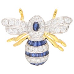 Broche abeille en or jaune et blanc 18 carats sertie de saphirs et de diamants