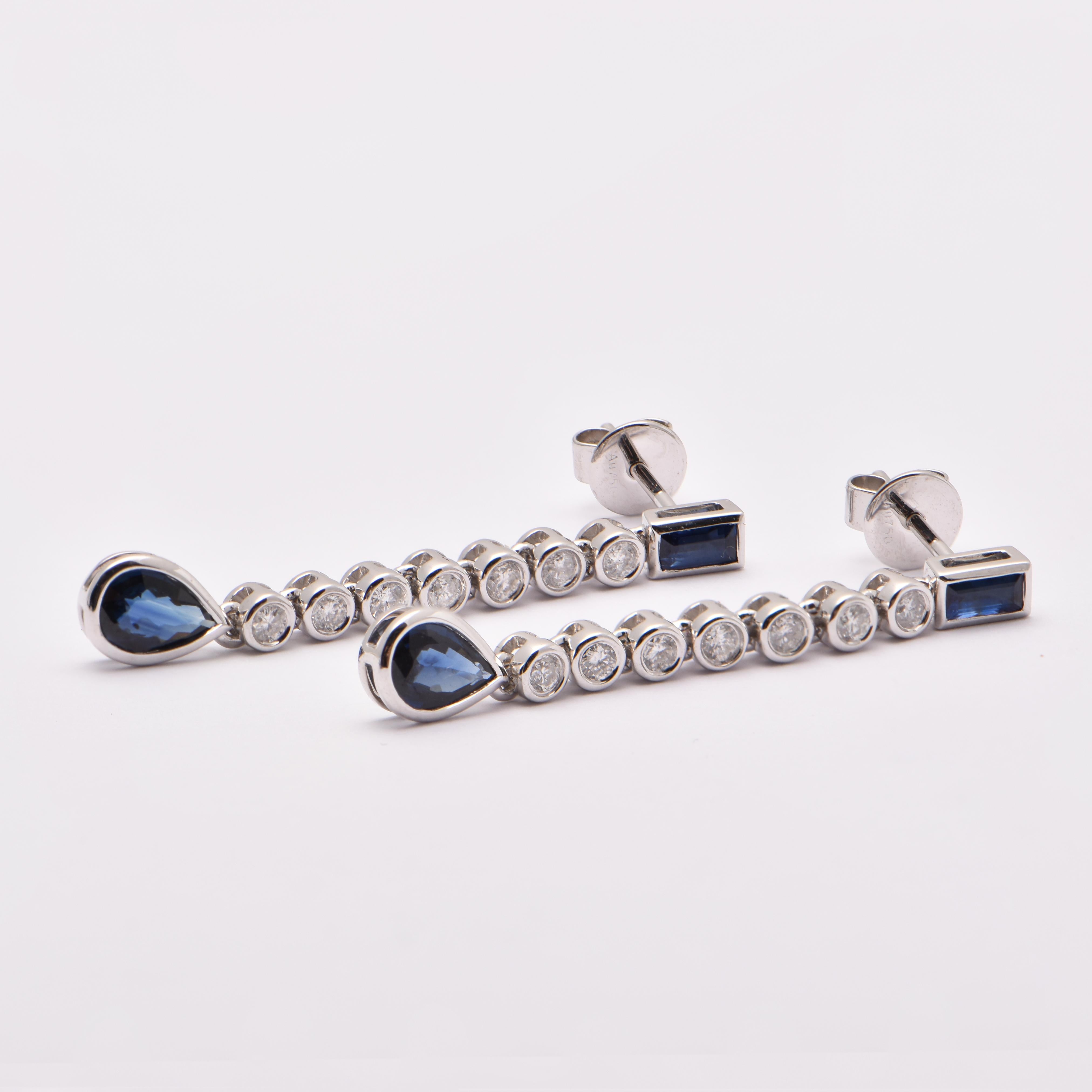 Sapphire and Diamond Bezel Set Drop Earrings in 18 Carat White Gold by Cartmer Jewellery

4 Sapphires totalling 1.15cts
14 Diamonds totalling 0.35cts
18ct White Gold Earrings

FREE express postage usually 3-4 days Sydney to New York  
FREE