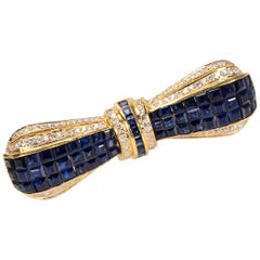 Sapphire and Diamond Bow Brooch in 18 Karat Yellow Gold 9.20 Carat
