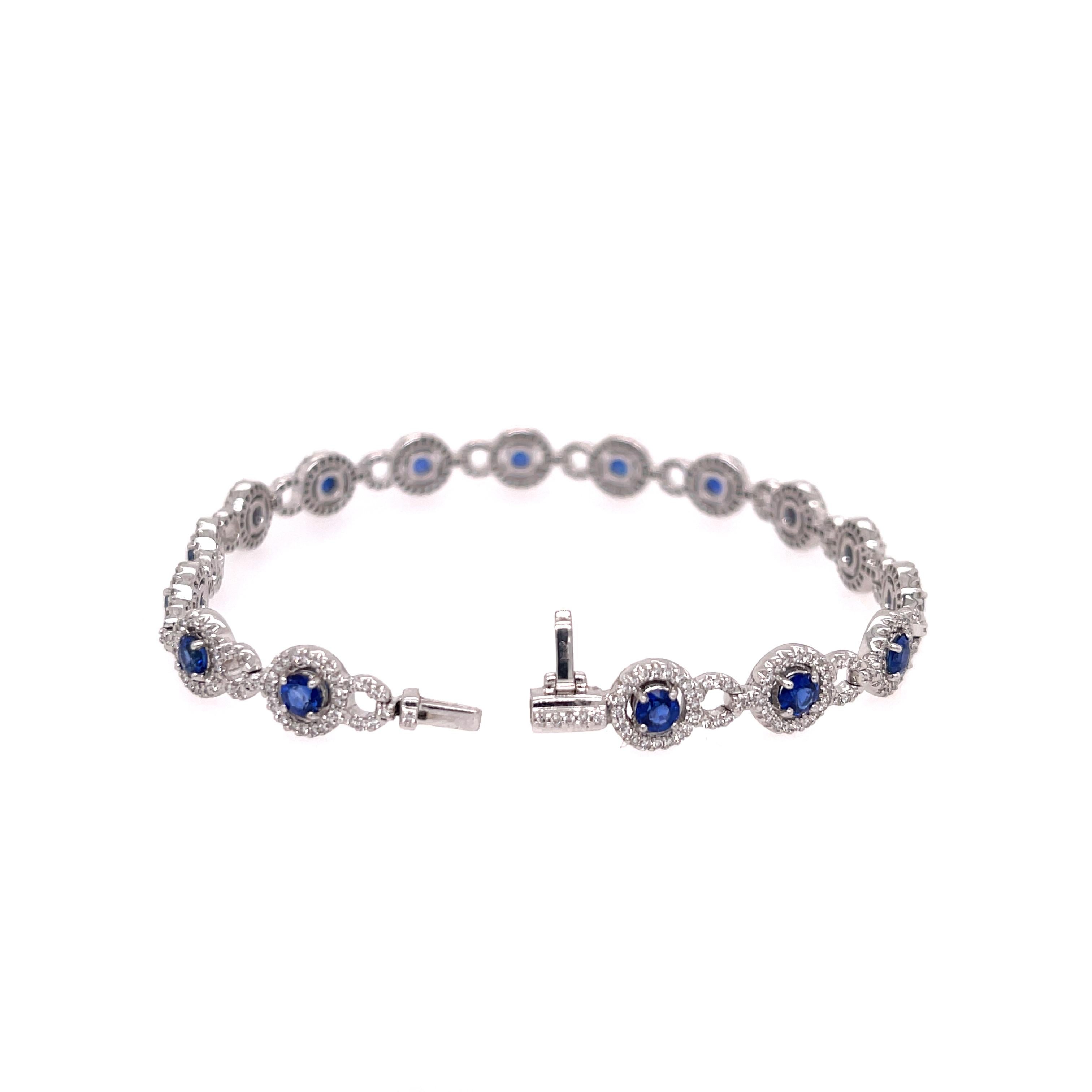Sapphire and diamond bracelet in 18K white gold. The bracelet features 16 round cut sapphires and 453 round cut diamonds with a 1.5ctw. Stamped 750 18k.