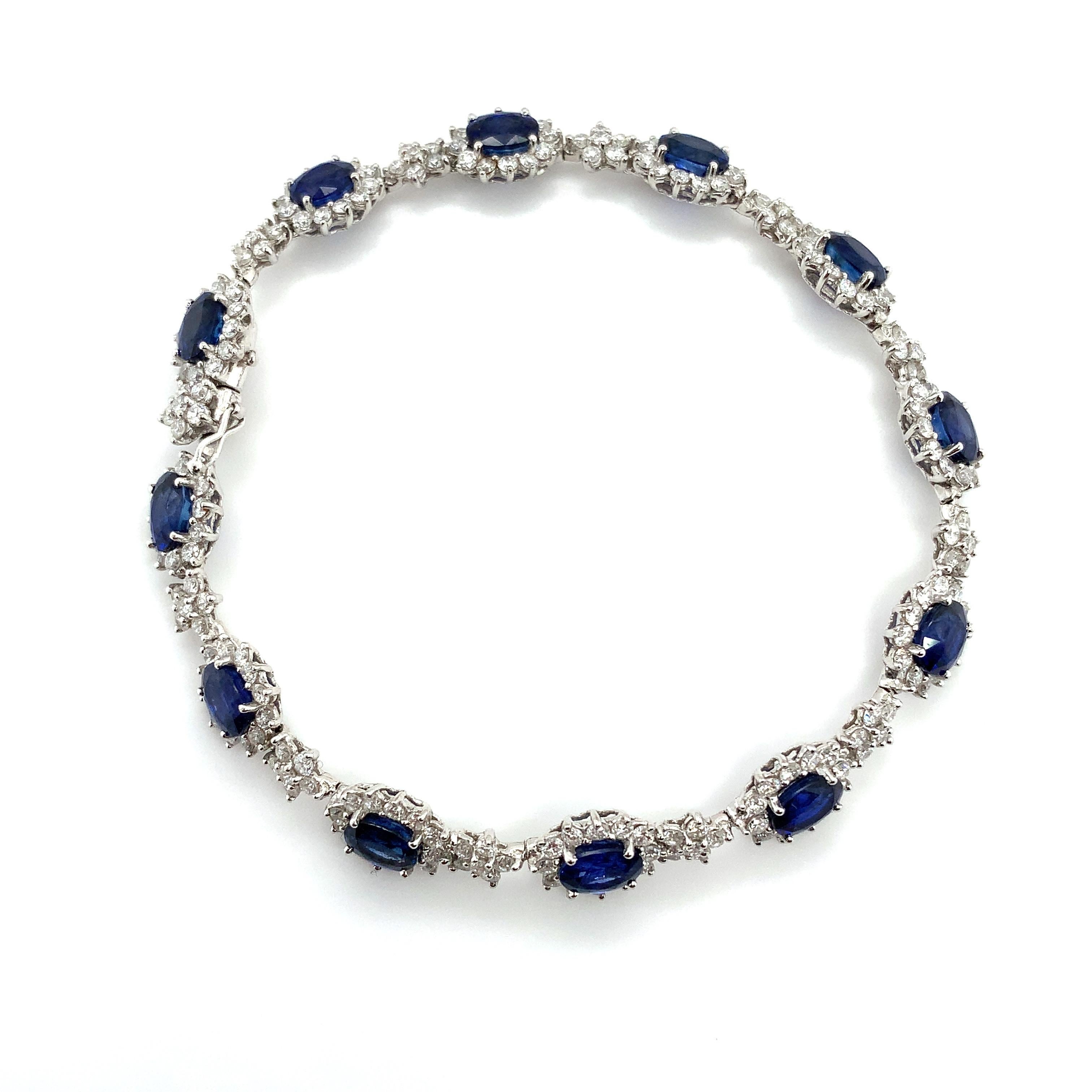 11.39ct Blue sapphire and diamond halo bracelet in 18k white gold.
Composed of oval-cut sapphires and accented by round brilliant-cut diamonds.
Beautiful duet blue Ceylon sapphire oval cut and sparkling round brilliant diamonds halo eternity