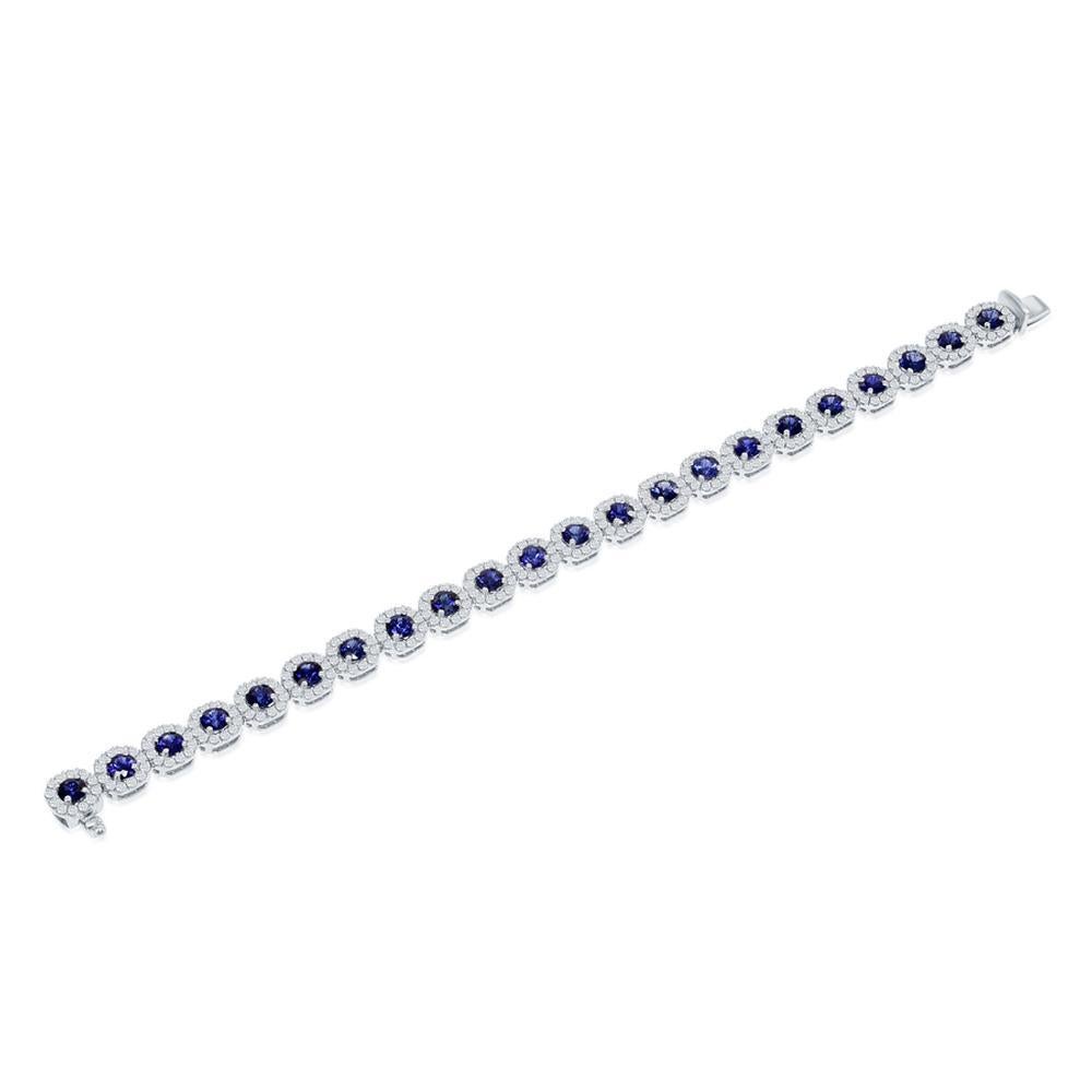 SAPPHIRE AND DIAMOND
BRACELET
A cornucopia of textures and shapes, this unique sapphire and diamond
bracelet combines classic styling with unexpected intrigue
Item: # 03071
Metal: 18k W
Color Weight: 9.90 ct.
Diamond Weight: 4.22 ct.