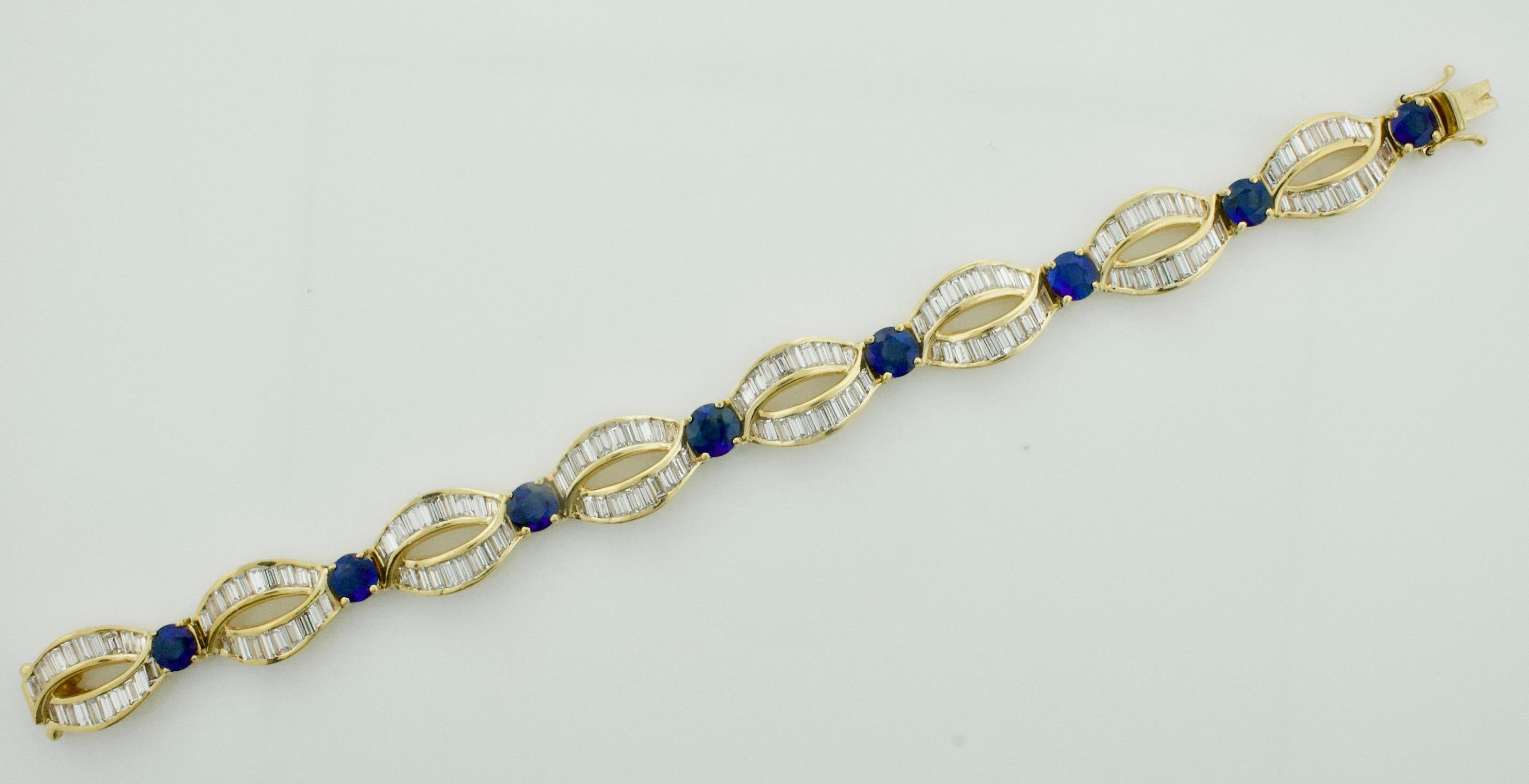 Sapphire and Diamond Bracelet in 18k Yellow Gold
Eight Round Sapphires weighing 8.00 carats approximately [bright with no imperfections visible to the naked eye]
One Hundred and Sixty Baguette Cut Diamonds weighing 11.20 carats approximately [GHI  -