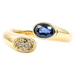 Sapphire and Diamond Bypass Ring in 18k Yellow Gold