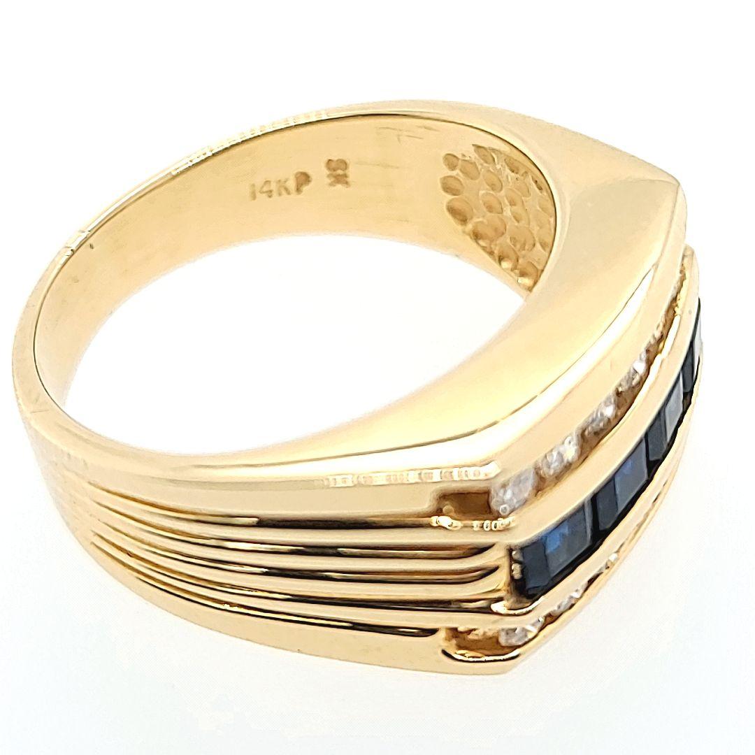 14 Karat Yellow Gold Channel Band Ring Featuring 4 Square Cut Sapphires Totaling Approximately 1.00 Carat Accented By 14 Round Brilliant Cut Diamonds of SI Clarity and H Color Totaling 0.33 Carat. Current Finger Size 8.5; Purchase Includes One