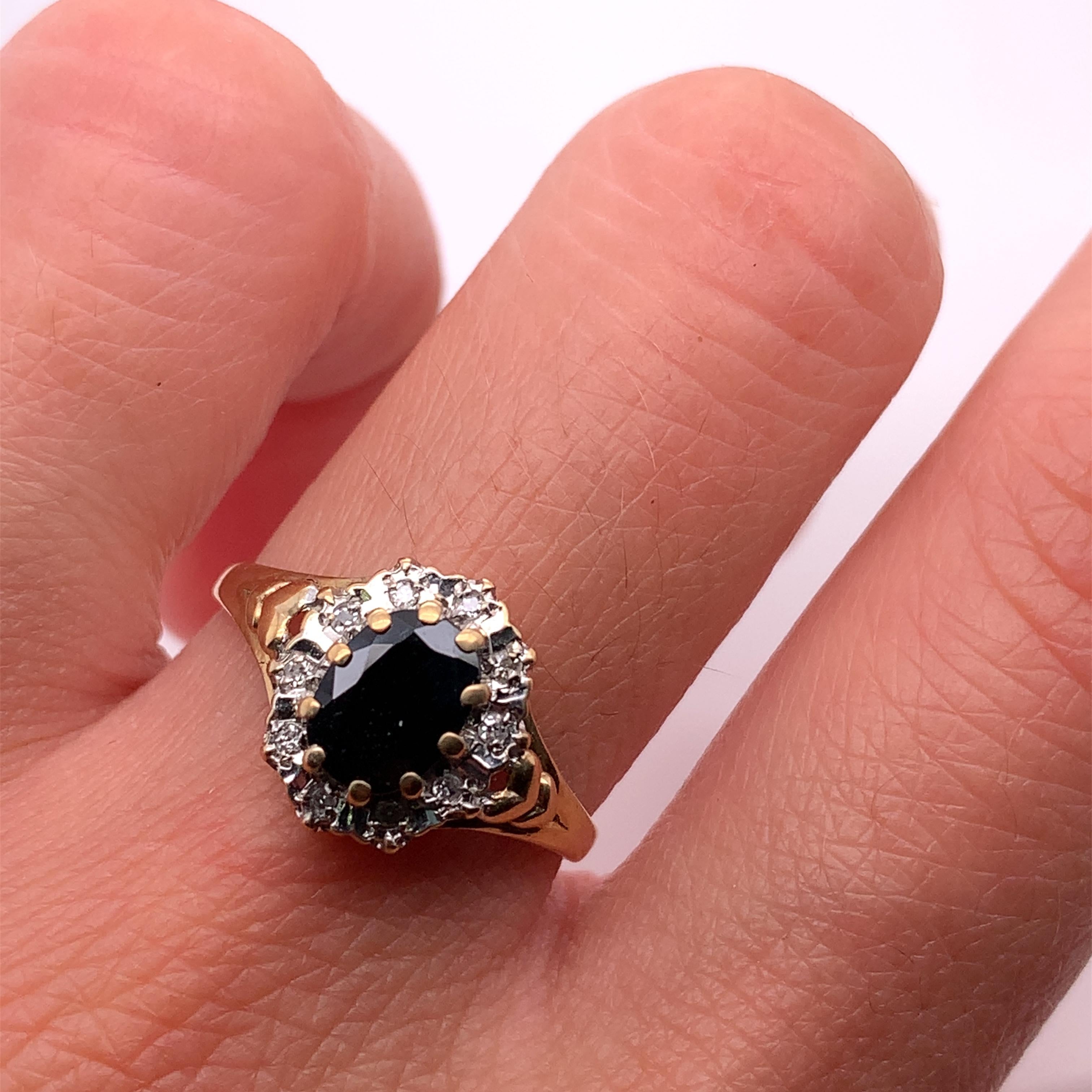 This beautiful engagement ring features a stunning 1.20ct sapphire diamond set in a classic solitaire style. The ring is crafted from 9ct yellow gold and boasts a chunky band width for added durability. The blue-coloured sapphire stone is natural