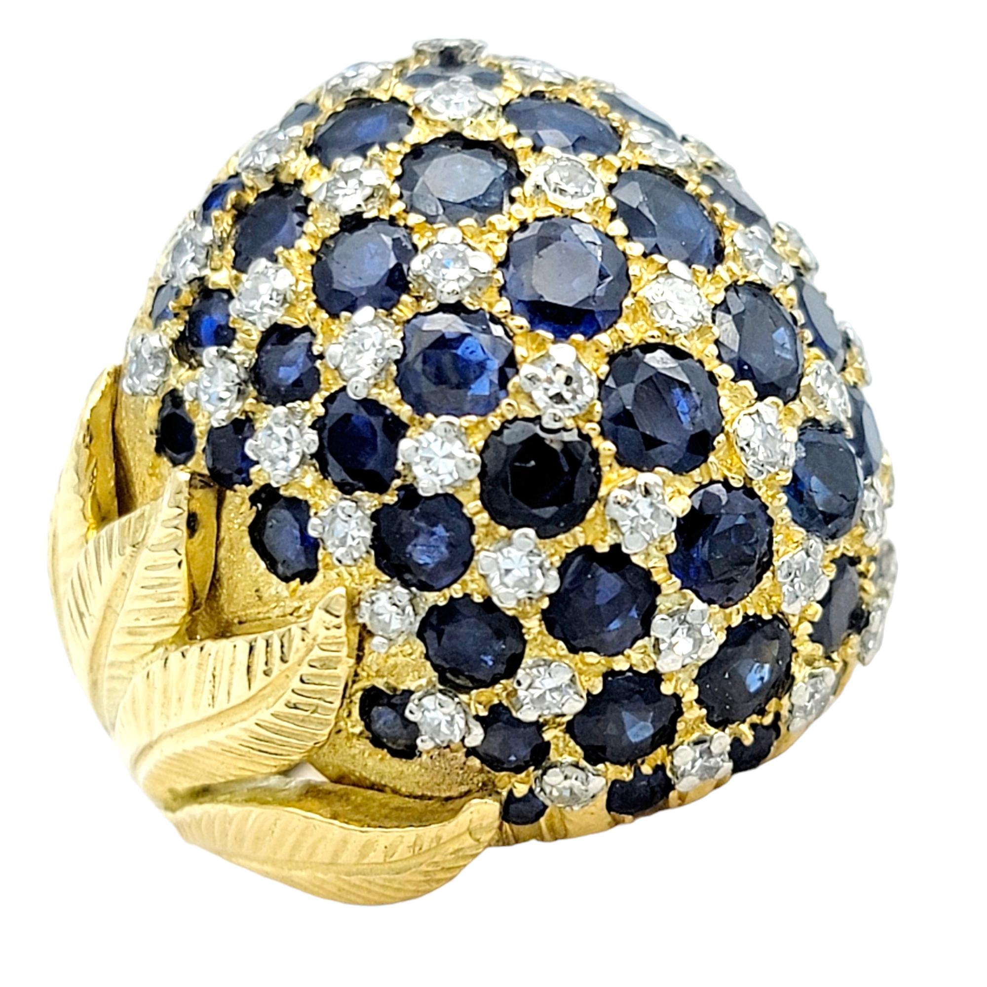 Ring size: 5.25

This opulent dome ring is a true embodiment of luxury and craftsmanship. Crafted in lustrous 18 karat yellow gold, this ring exudes timeless elegance with a contemporary feel.

The focal point of this remarkable piece is an array of