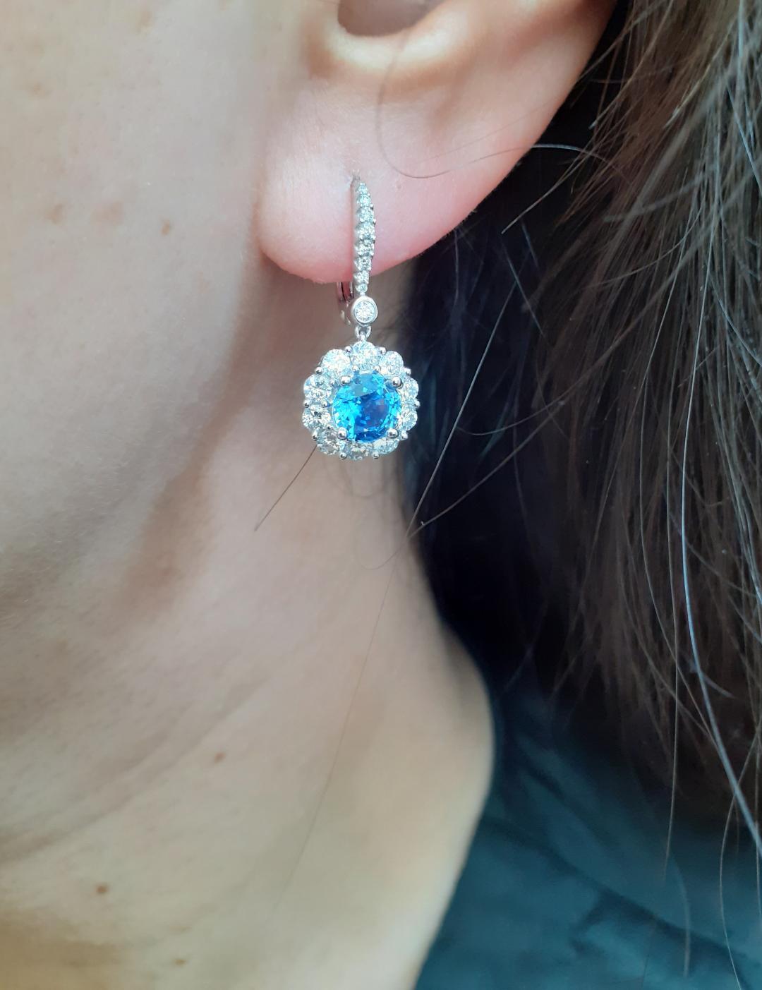 Modern Sapphire and Diamond Cluster Drop Earrings Set in 18 Karat White Gold For Sale