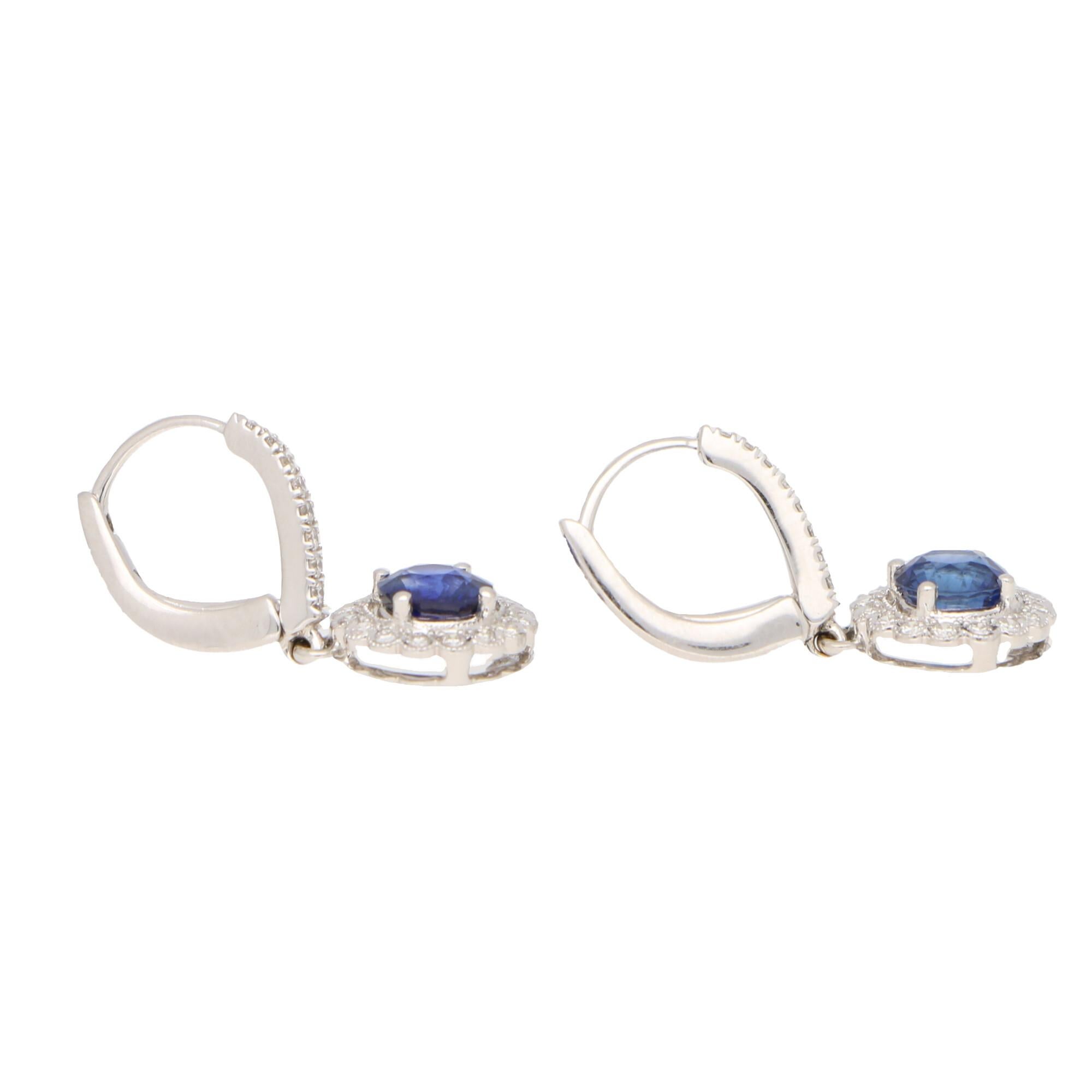Round Cut Sapphire and Diamond Cluster Drop Earrings Set in 18 Karat White Gold For Sale