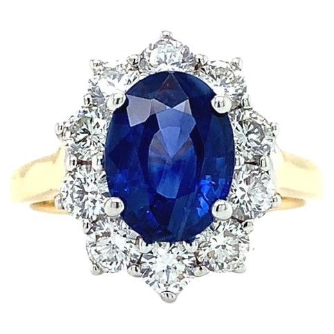 Sapphire and diamond cluster engagement ring 18k yellow gold