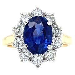 Sapphire and diamond cluster engagement ring 18k yellow gold