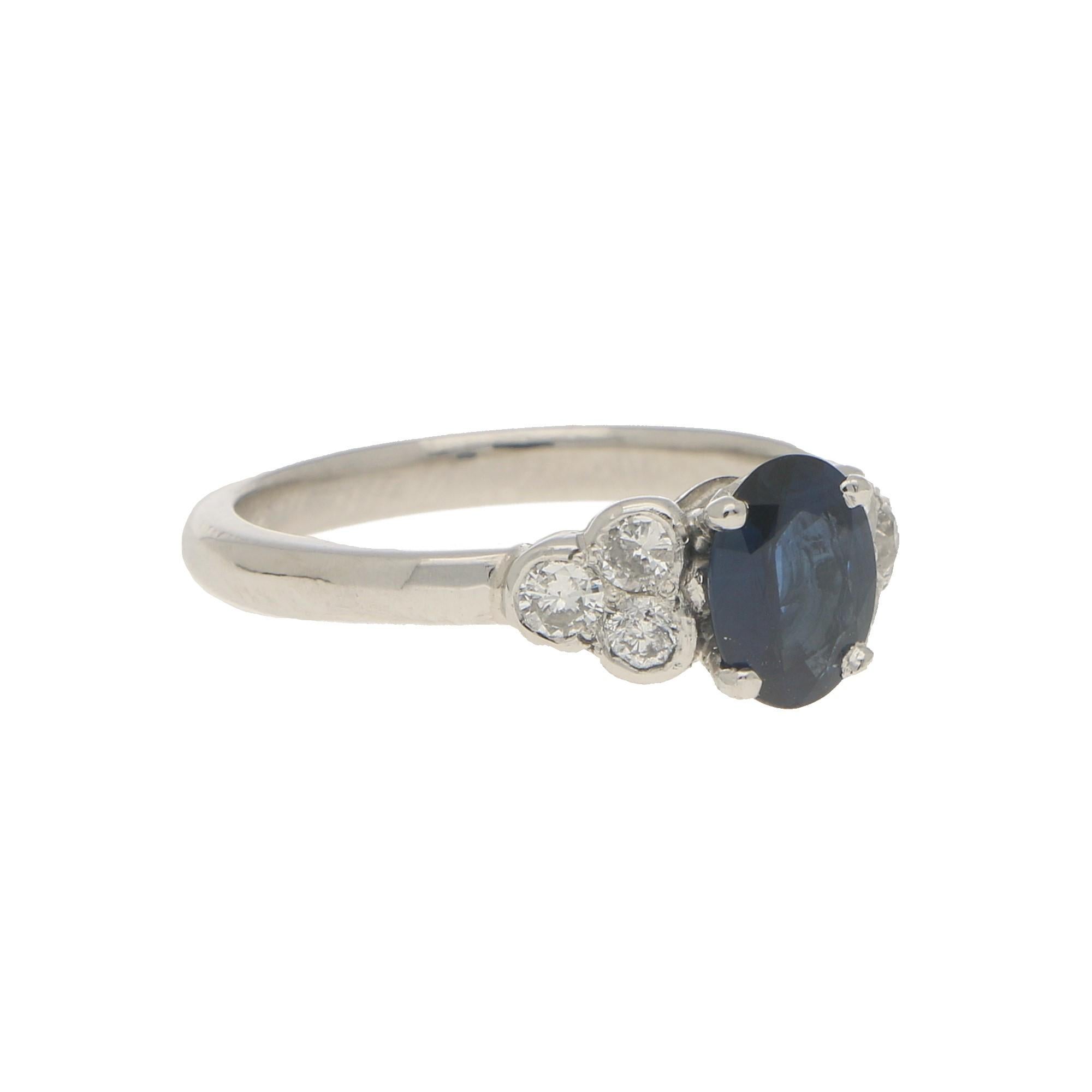 Oval Cut Sapphire and Diamond Cluster Engagement Ring Set in Platinum