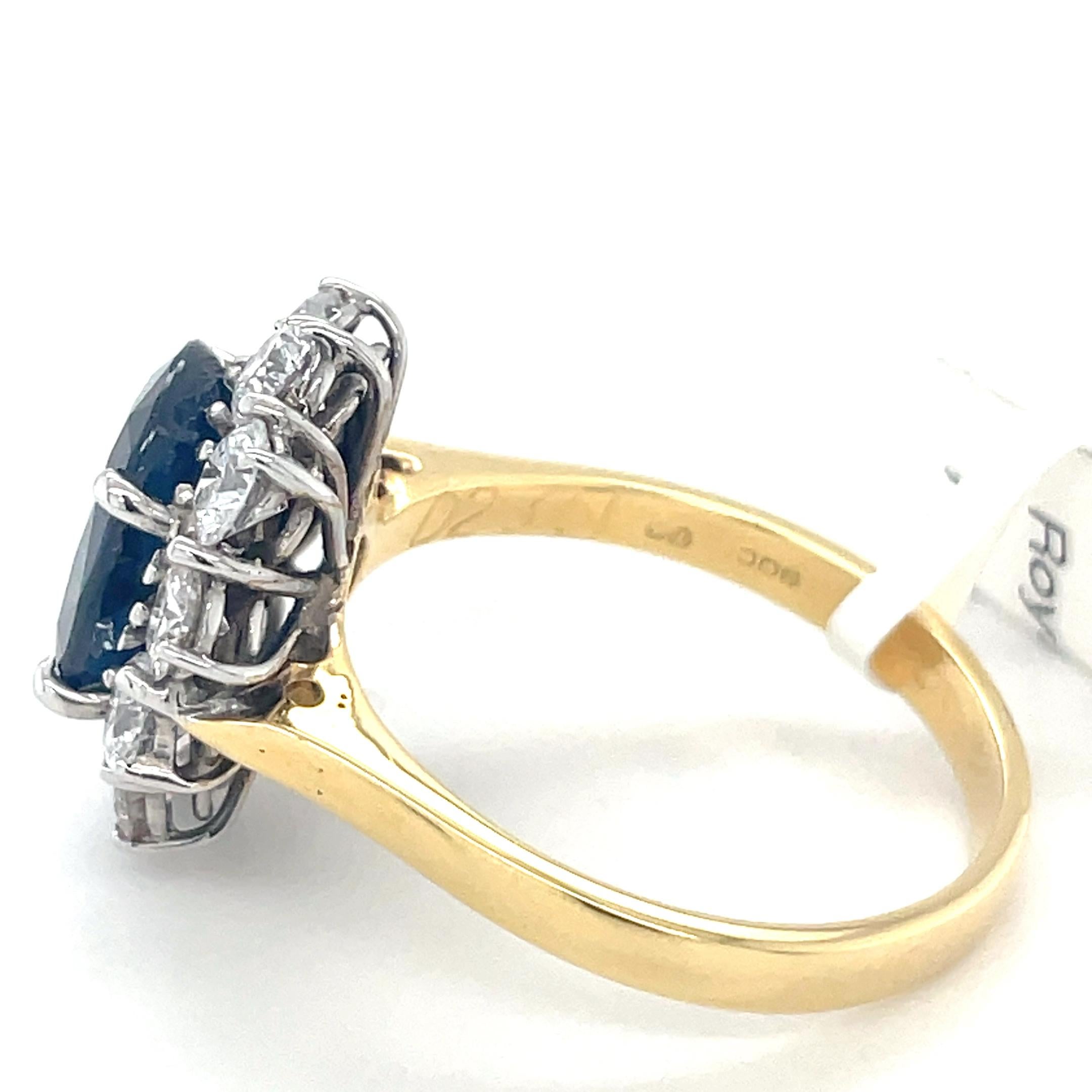 Stunning cluster ring in 18ct yellow gold and 18ct white gold classic elegance to adorn your hand.
At the centre of this cluster a beautiful lively ceylon blue  oval cut sapphire. Surrounded by a halo of bright and lively brilliant cut diamonds.
A