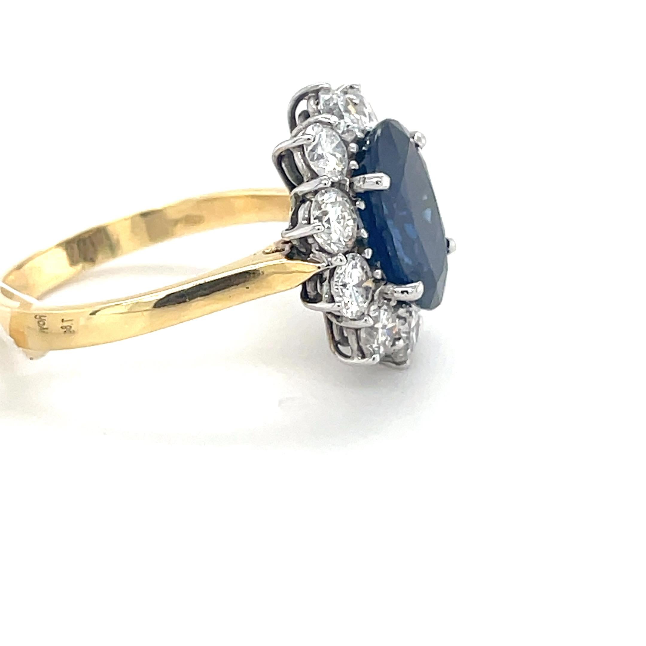 Oval Cut Sapphire And Diamond Cluster Ring 5 carat Sapphire & 2.35 Carat Diamonds For Sale