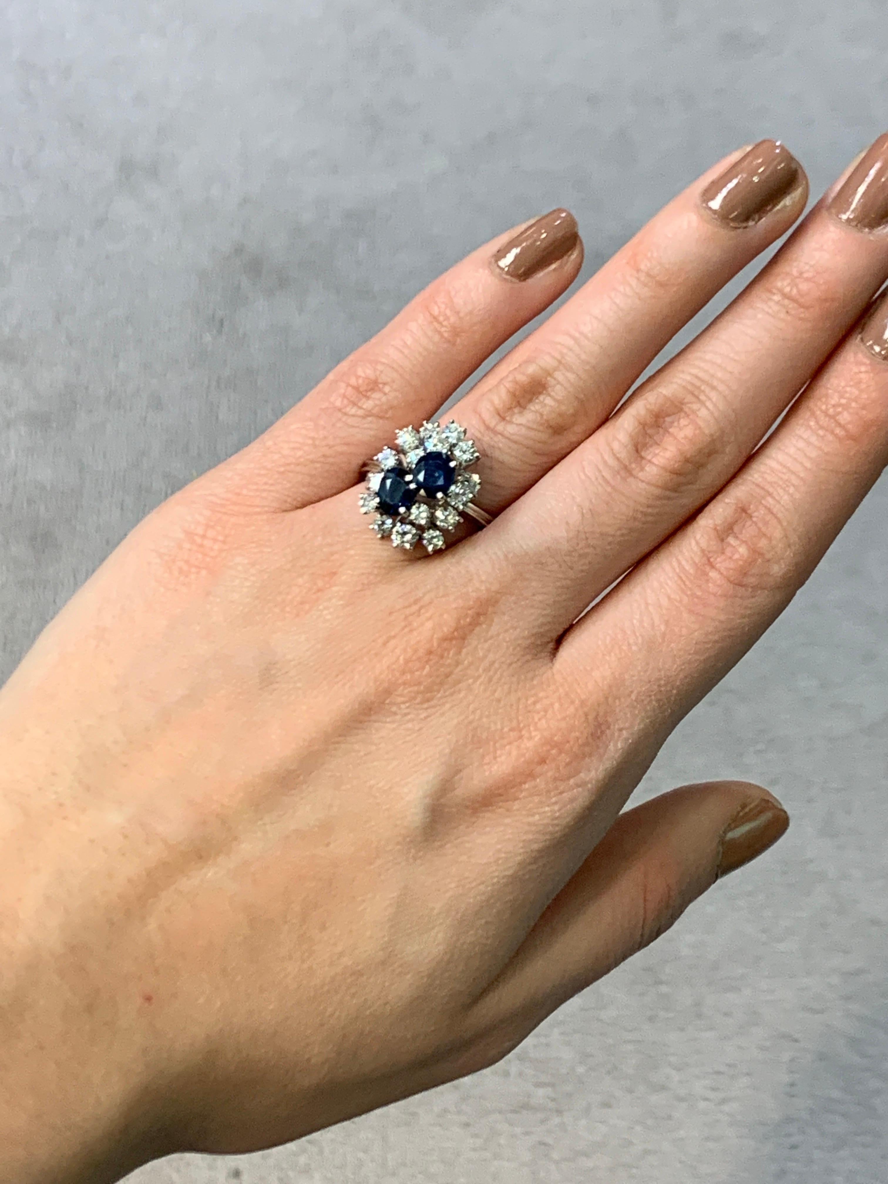 Sapphire and Diamond Cluster Ring

A white gold ring set with two oval cut sapphires surrounded by a cluster of round cut diamonds. 

Metal Type: 18 Karat Gold 

Ring Size: 6.5 

Resizable free of charge