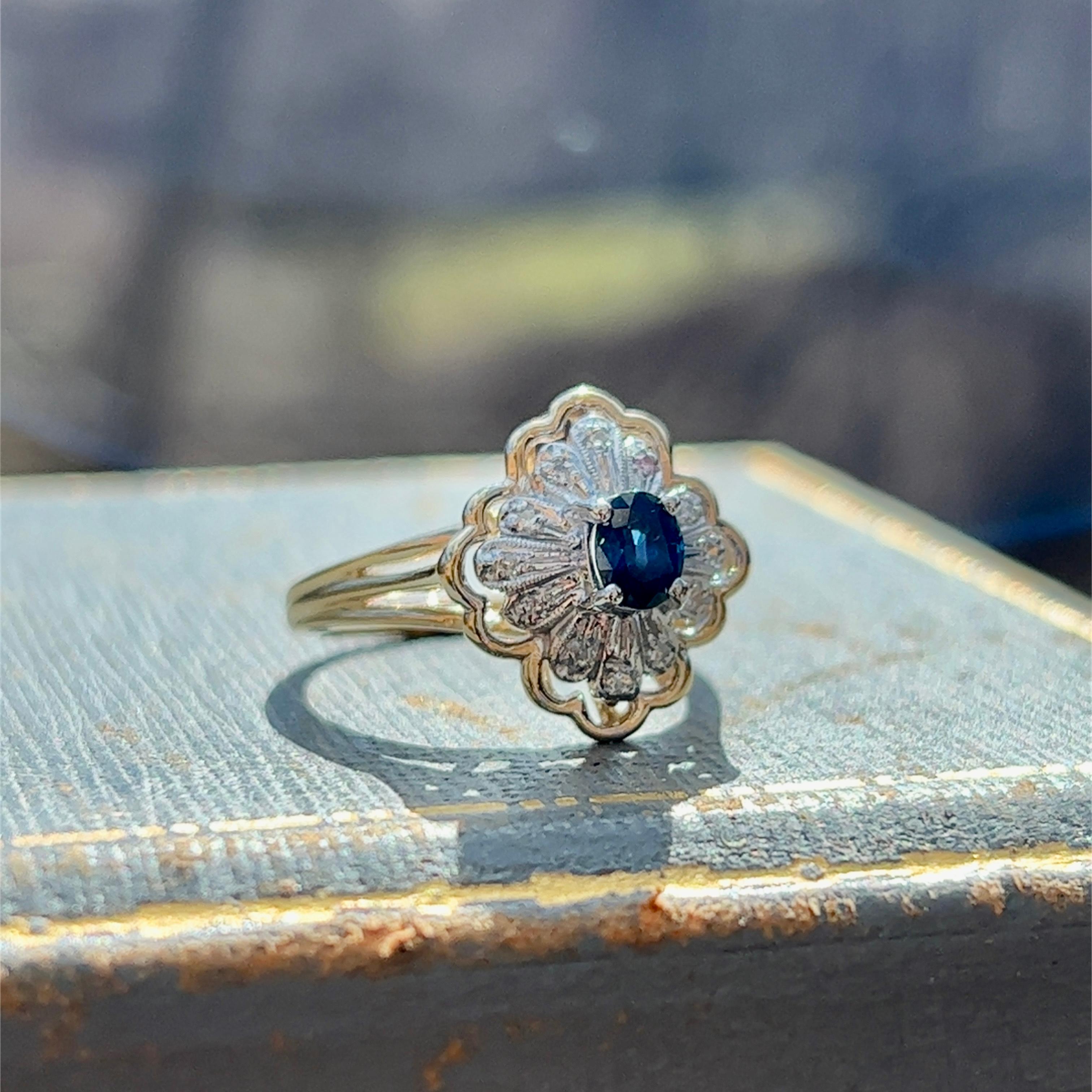 Oval Cut Sapphire and Diamond Cluster Ring in 14k White and Yellow Gold