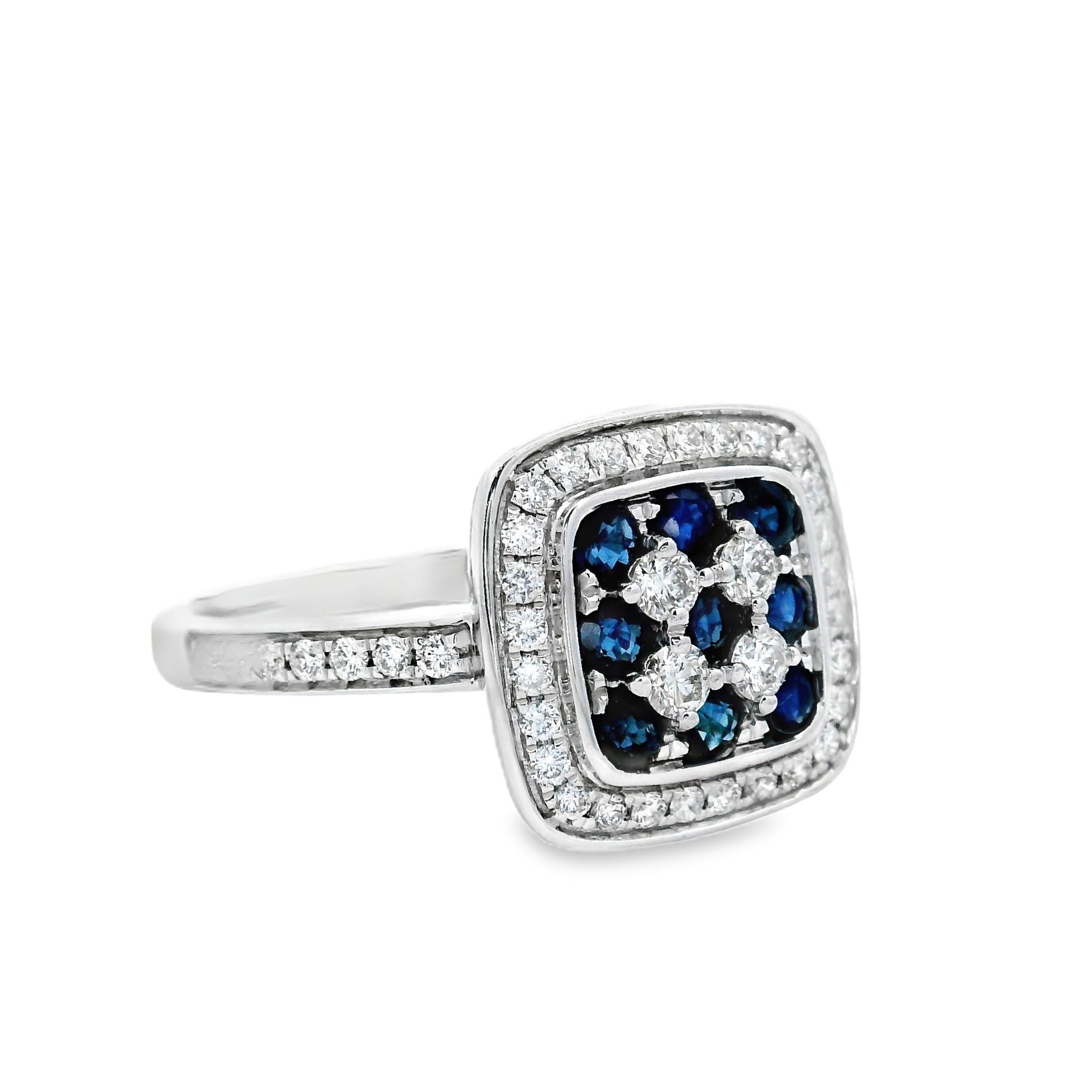 Strikingly graphic and rich in contrast, this sapphire and diamond cocktail ring features a modern take on classic geometry. At its center, nine deep blue sapphires (0.60 carats total) are set in a grid formation, offset by bright white diamonds