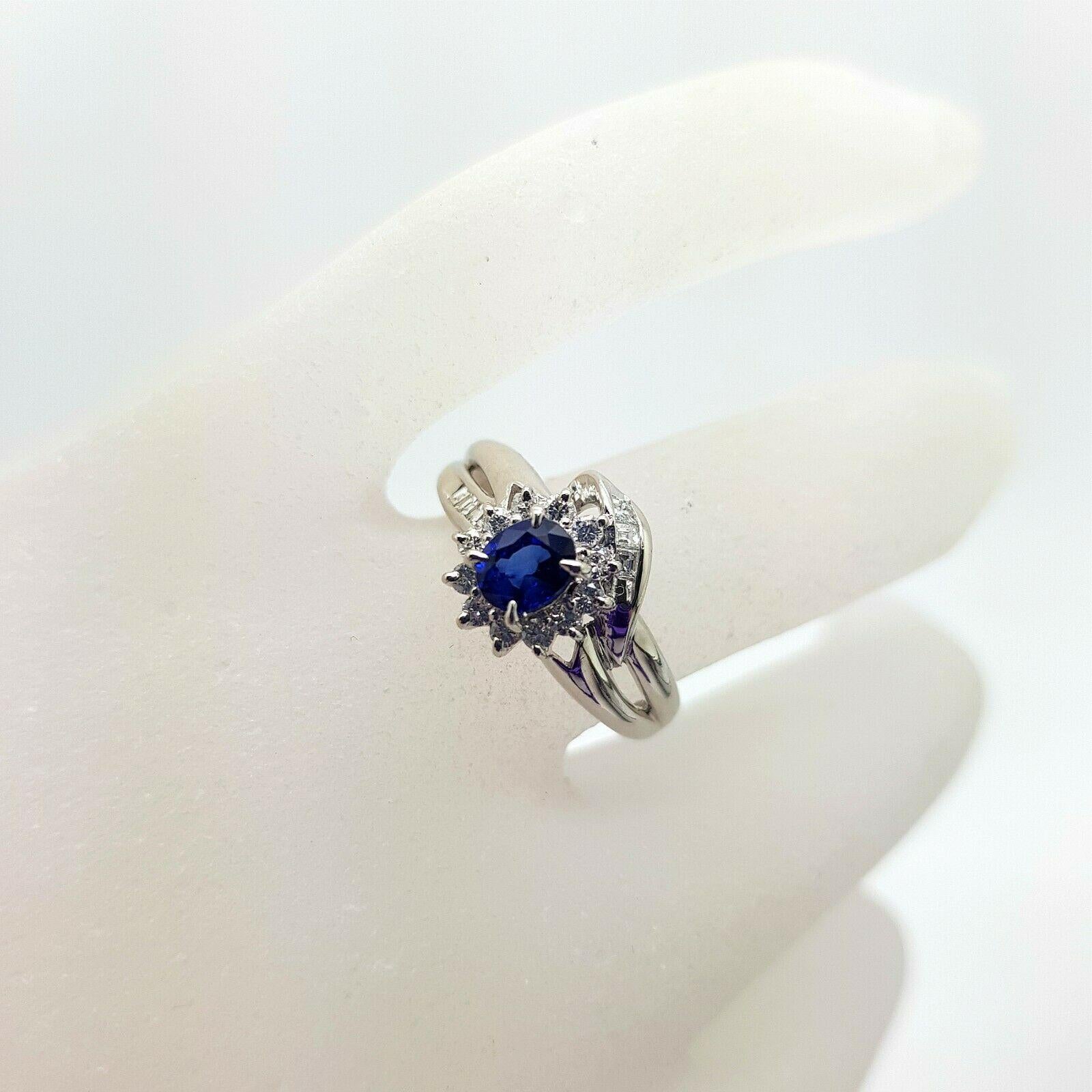  Specifications:
    main stone: BLUE SAPPHIRE  0.48 ct
    additional: ROUND DIAMONDS
    diamonds: 12 PCS
    carat total weight: 0.30
    color: n/a
    clarity: n/a
    brand: custom
    metal: PLATINUM PT900
    type: HALO
    weight: 4.70 gTW
