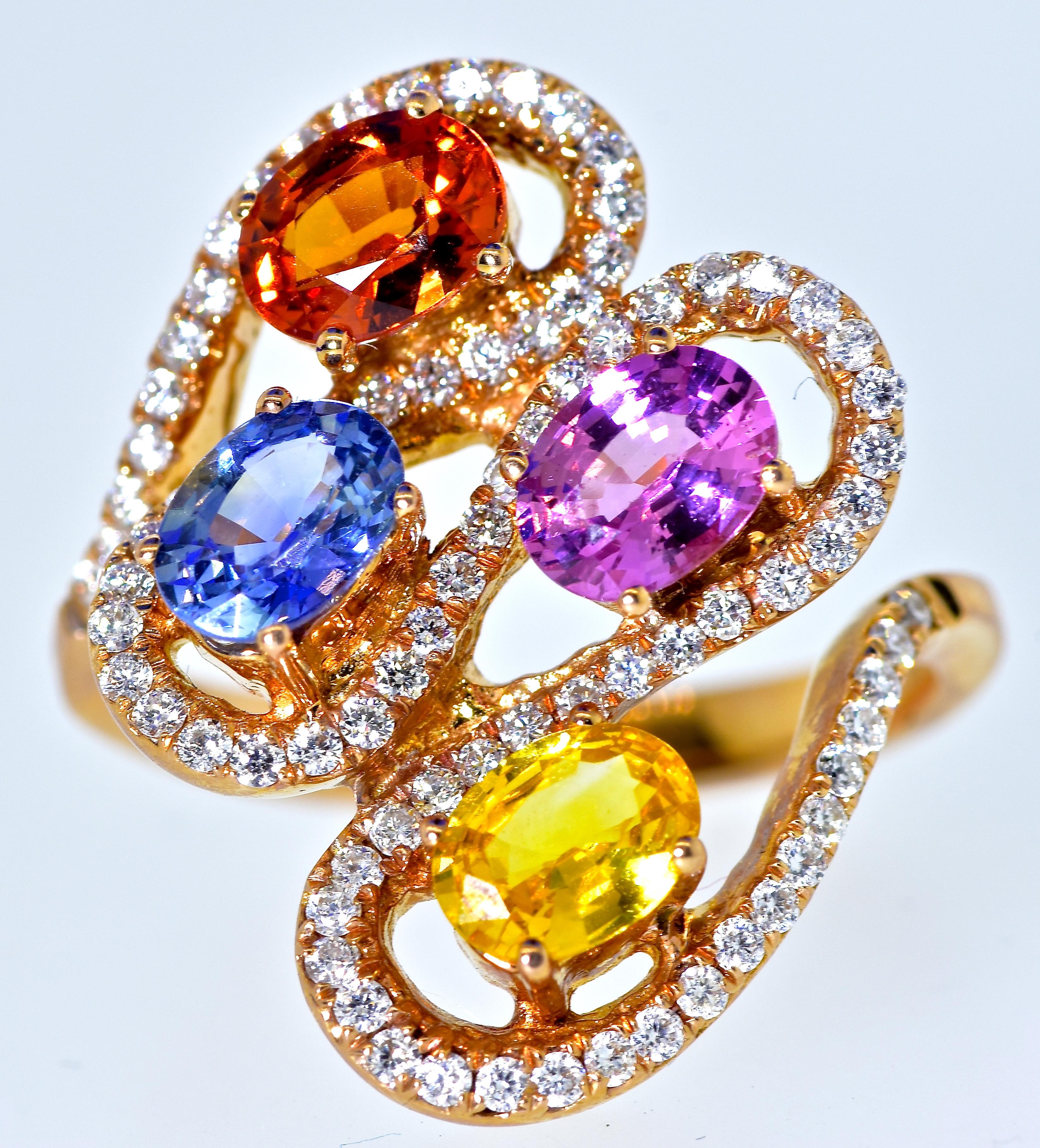 Sapphires of different fine colors weigh totally 2.67 cts., and marked as such on the interior of the shank.  The sapphires are all a bright and pleasing color.  They are well matched in size and shape and brilliance.  There is an orange sapphire,