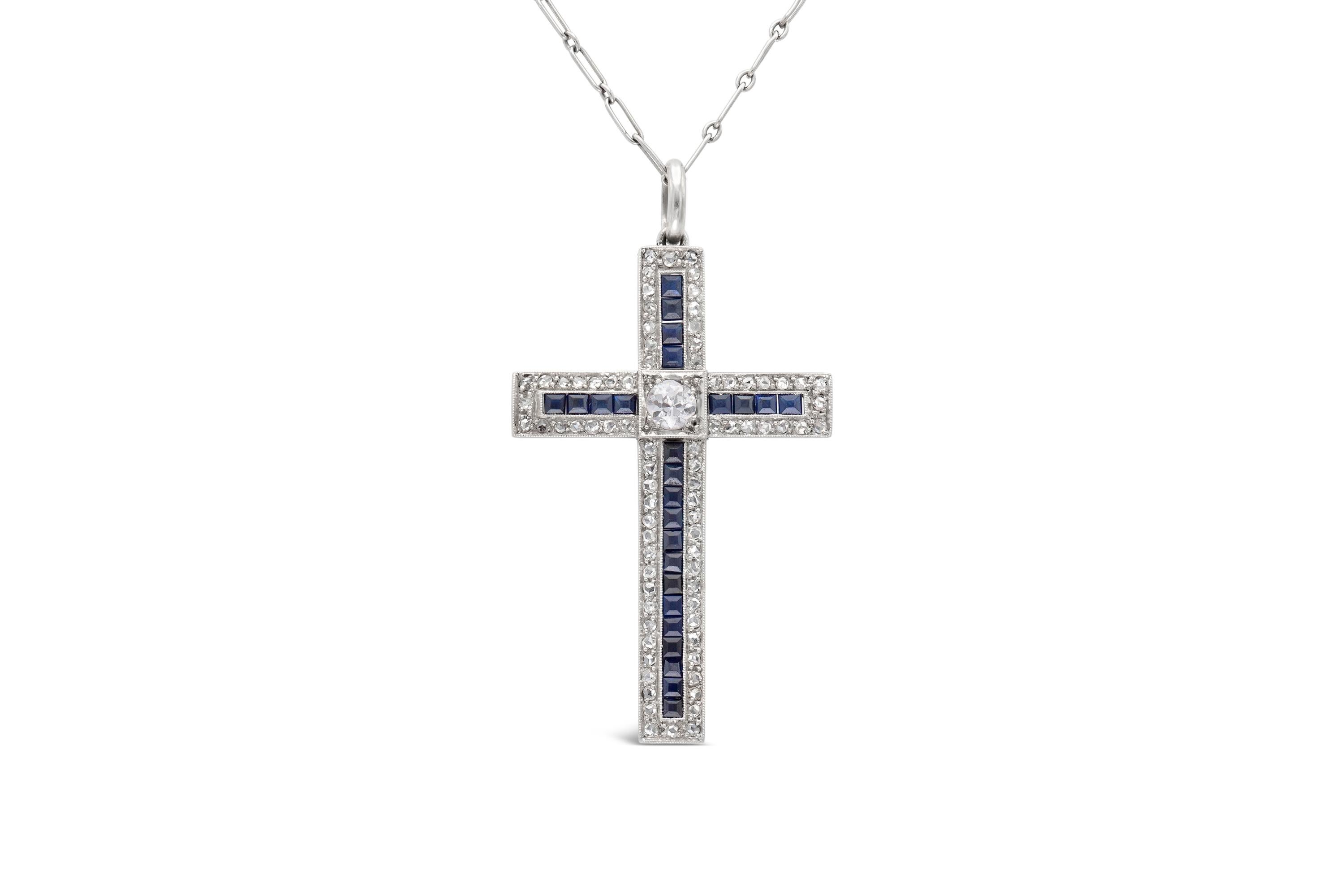 Finely crafted in platinum, featuring a center Old European-cut diamond weighing approximately 0.40 carat with an additional 0.80 carat of rose-cut diamonds and French-cut sapphires weighing approximately 0.72 carat. Circa 1920's-30's.
The cross