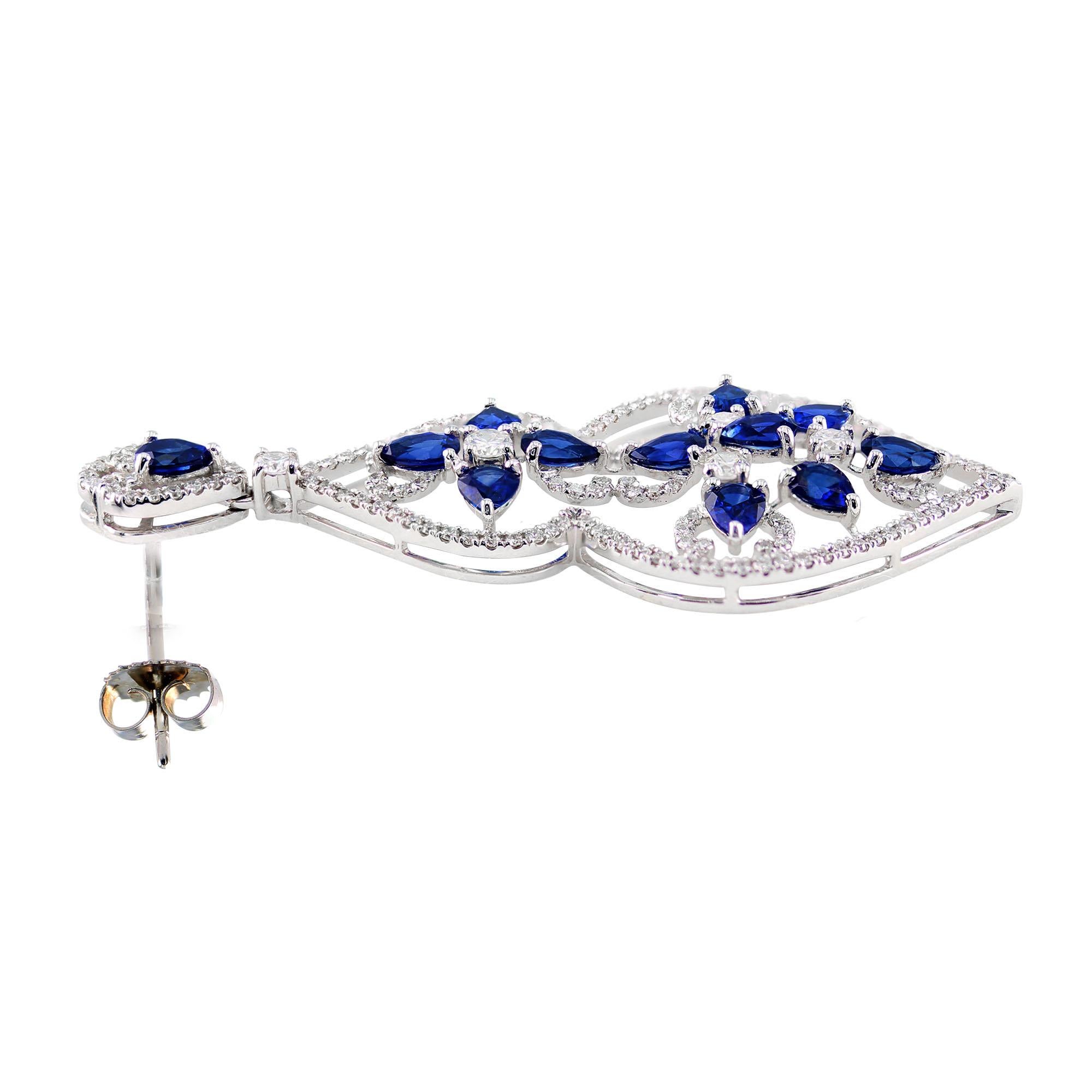 4.29 carat sapphire dangle earrings, complimented by 1.50 carat round diamonds, total weight.

Set in 18K

With its intricate design and exquisite attention to detail, step out in these absolutely stunning and elegant eye catching earrings, perfect