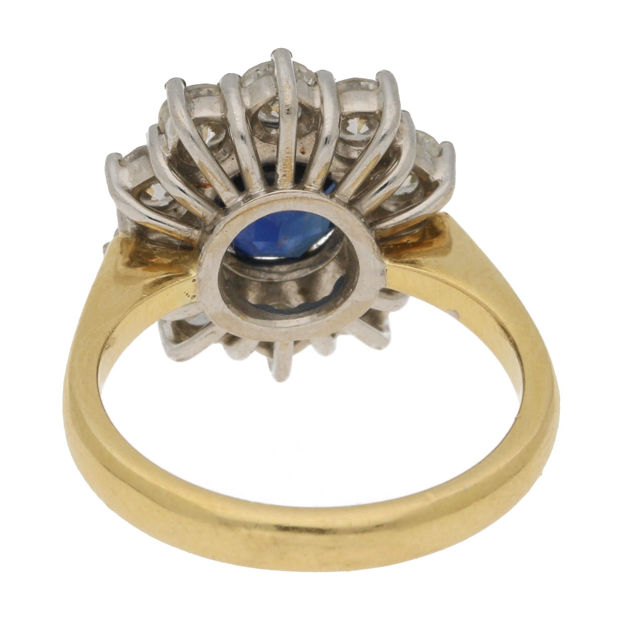 Round Cut Sapphire and Diamond Diana Style Cluster Engagement Ring in 18 Karat Yellow Gold