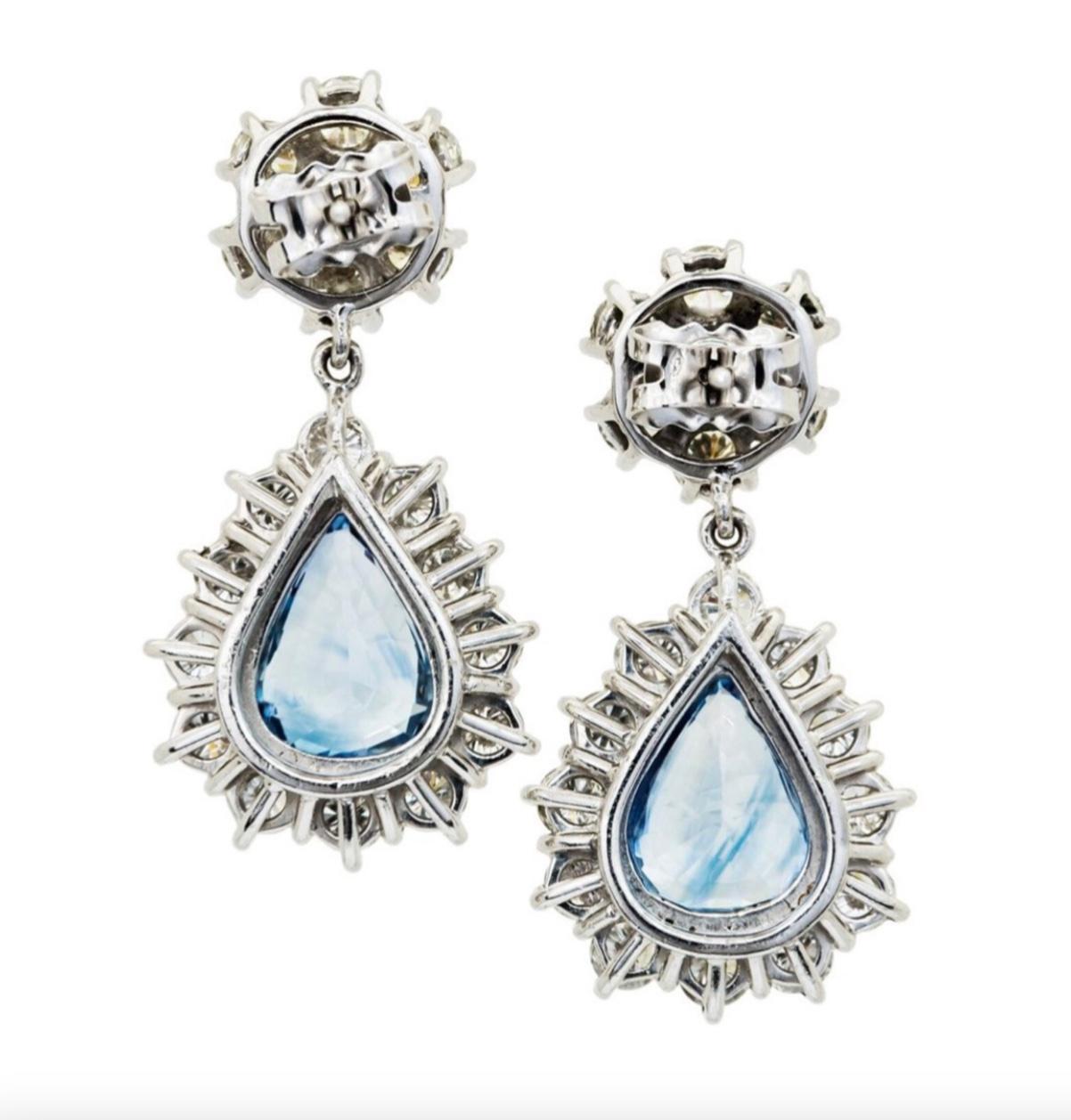 A pair of stunning articulated sapphire and diamond cluster drop earrings mounted in 18 carat white gold.

Two pear shaped sapphires of approx 7.20 carats in total surrounded by thirty-eight brilliant-cut diamonds of approx 5 carats in total.