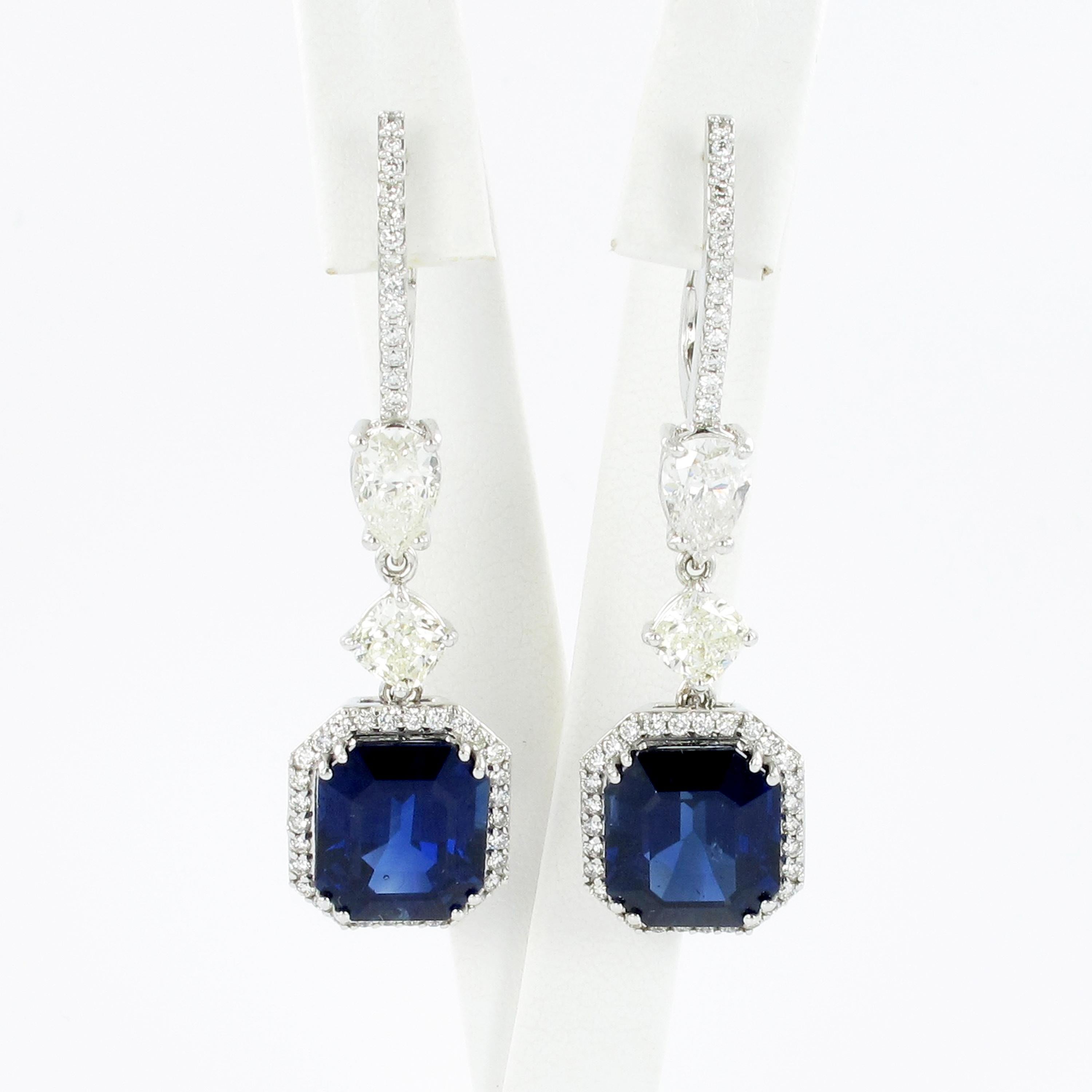Elegant pair of ear hanger in white gold 750. Beautifully set in four double prongs with two blue sapphires totaling 12.50 ct. Further set with two pear shape diamonds and two cushion shape diamonds totaling 2.52 ct all together. The 86 smaller