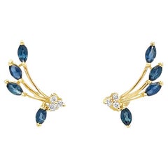 Sapphire and diamond ear crawler in yellow gold