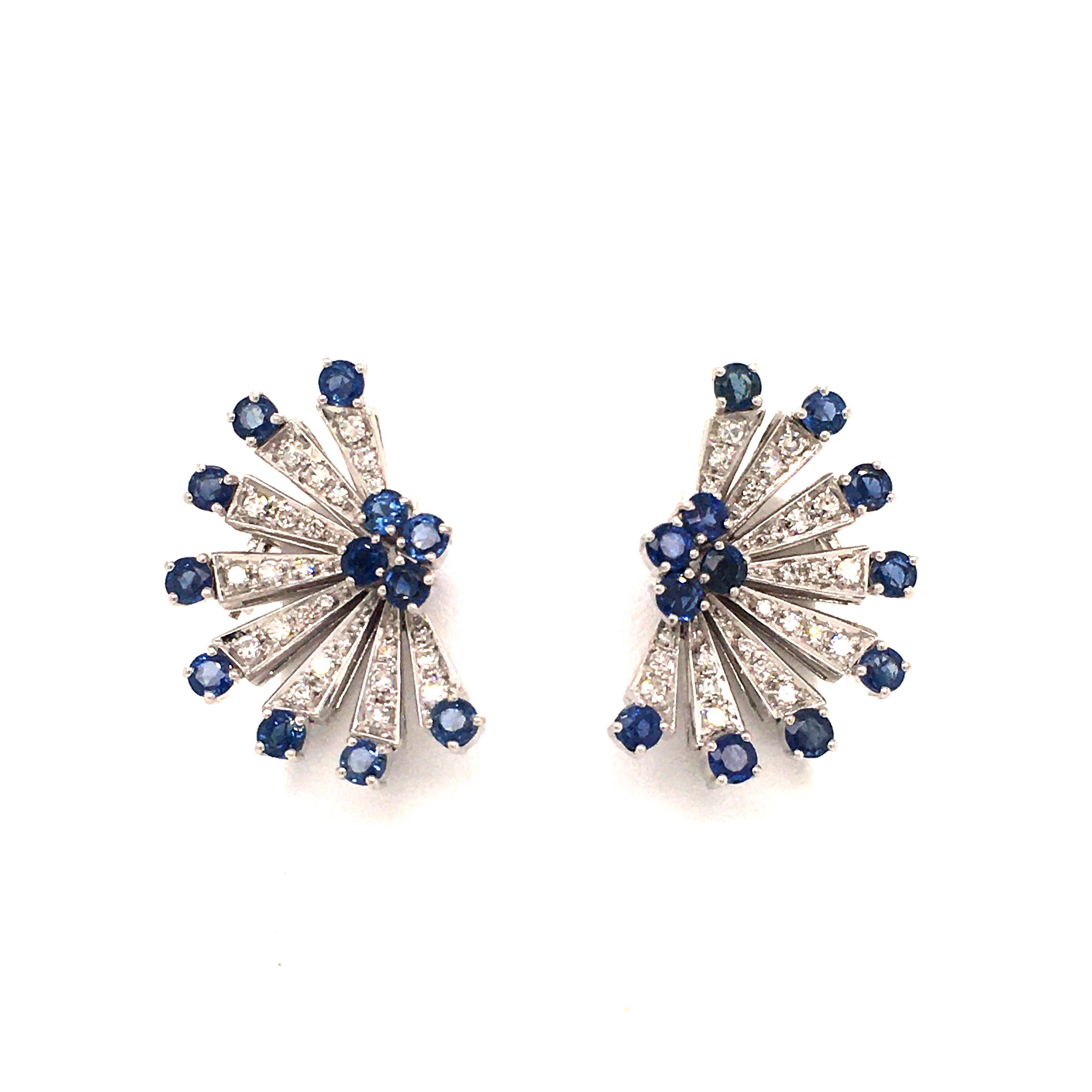 These semi-star shaped earclips in 18 karat white gold are set with 24 round cut sapphires, total weight approximately 2.88 carats, and 48 single cut diamonds of G/H color and vs clarity, total weight approximately 0.96 carats.

Dimensions approx.: