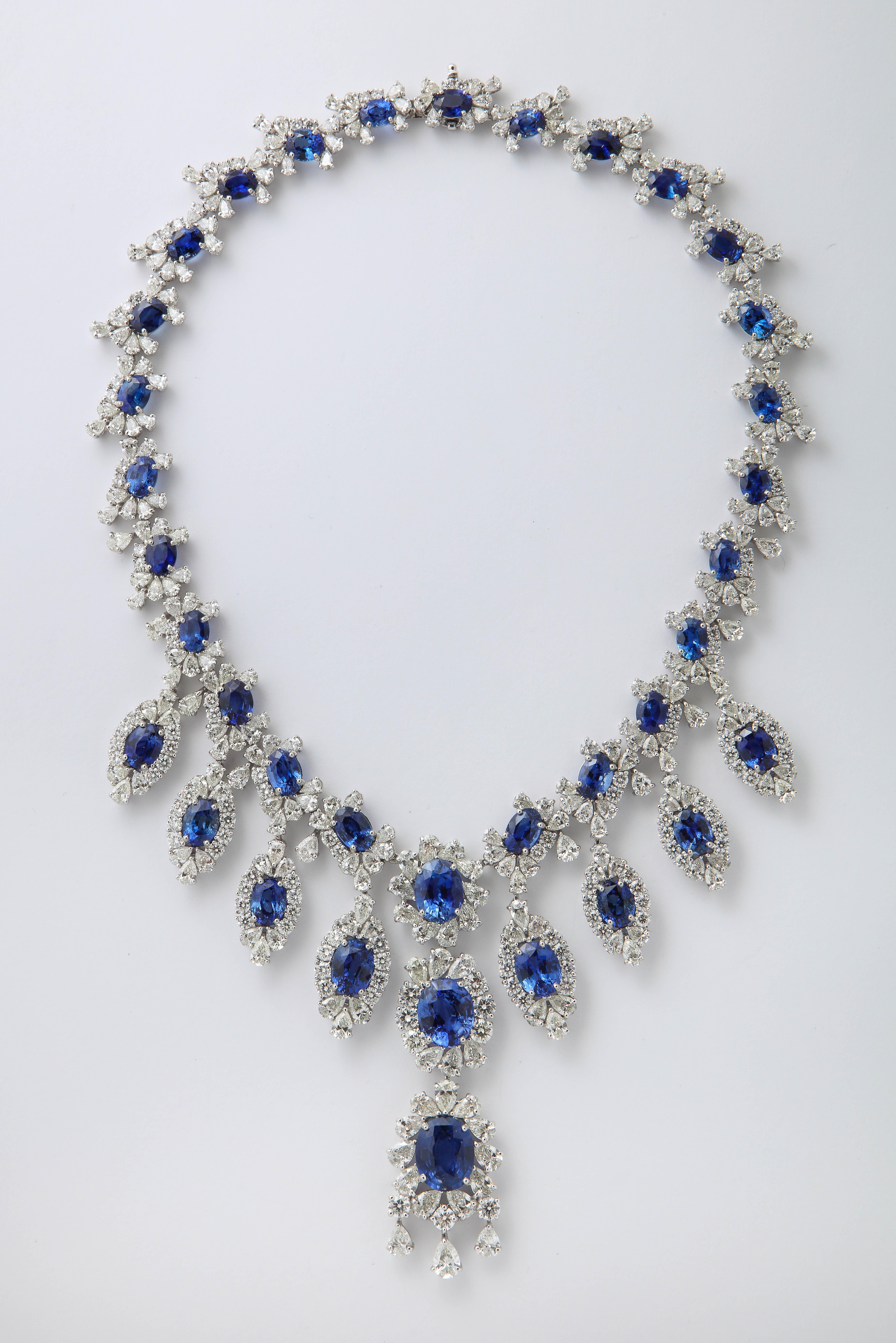 
An grand and important sapphire and diamond earring and necklace set. 

116.50 carats of vivid blue to blue Ceylon Sapphires.

91.19 carats of white round brilliant cut and pear shaped diamonds. 

Set in Platinum 

Certified by Christian Dunaigre