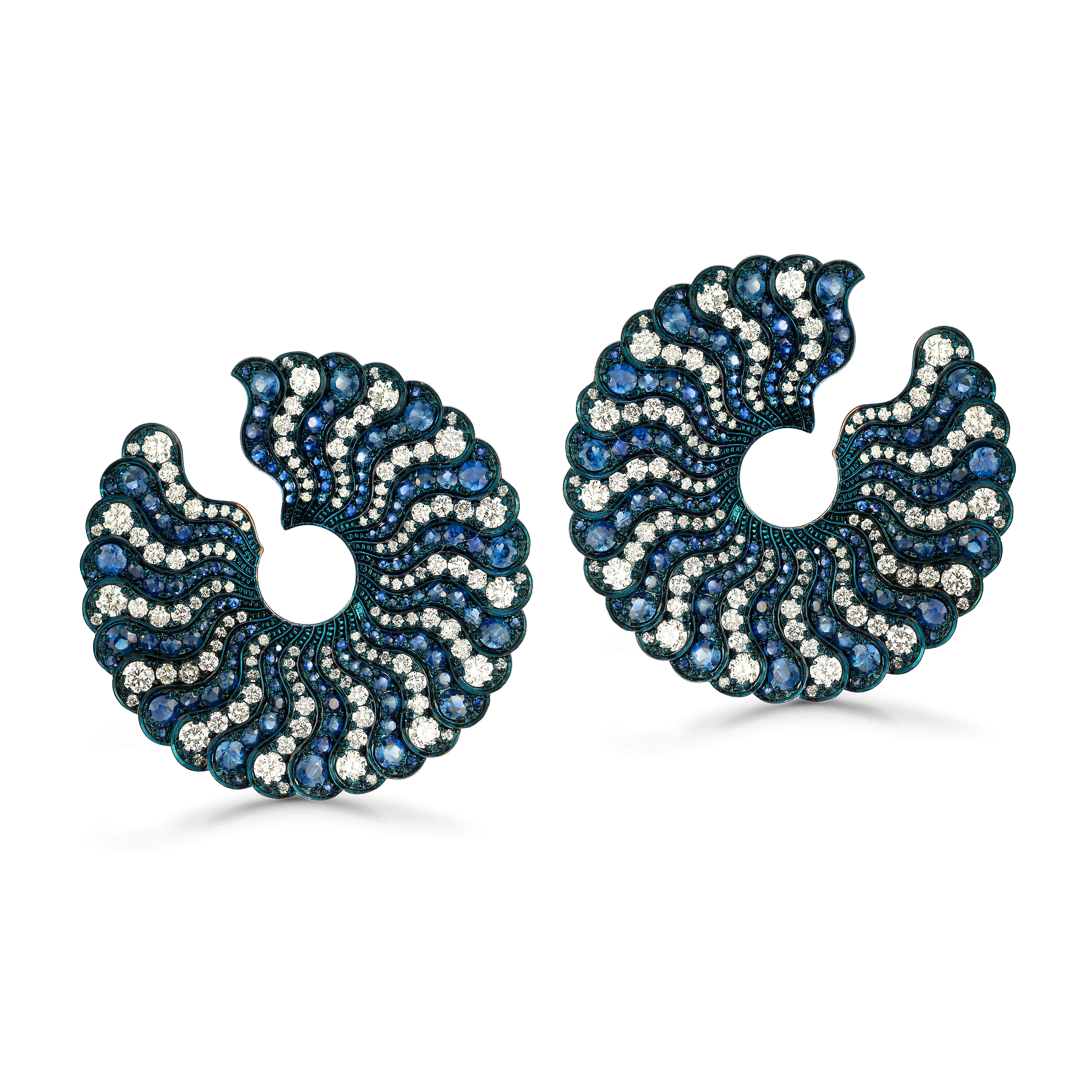 Sapphire and Diamond Earrings

A pair of 18 karat gold circular earrings set with alternating rows of diamonds and sapphires

Total Approximate Diamond Weight: 4.5 carats
Total Approximate Sapphire Weight: 6 carats

Back Type: Clip-on with