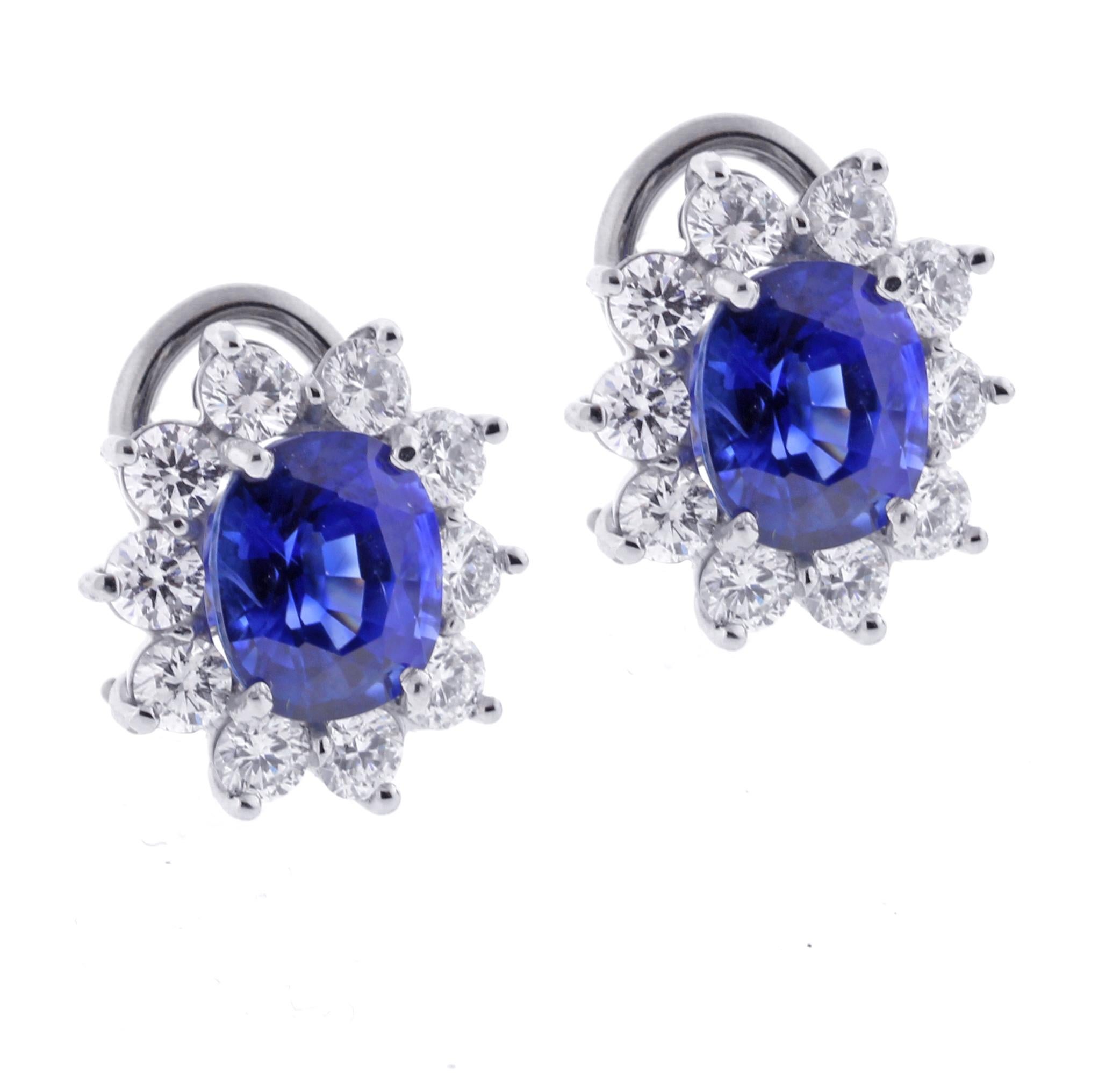 From the master jewelers of Pampillonia, a pair of oval sapphire and diamond cluster earrings.
♦ Designer: Pampillonia 
♦ Metal: Platinum
♦ 2 Oval sapphires=4.08 Heated
♦20Diamonds=1.41 carat G VS
♦ Circa 2000
♦ Size 6, Resizable
♦ Packaging: