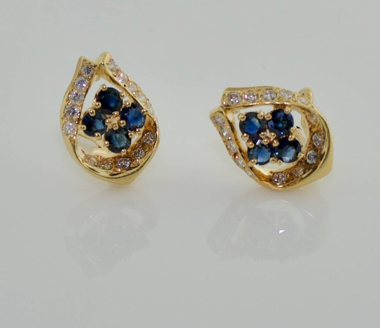 Sapphire and Diamond Earrings in Yellow Gold
Eight Vibrant Blue Sapphires weighing 1.00 carats approximately
Thirty Round Brilliant Cut weighing 1.00 carats approximately GH VVS-SI1
Clip Backs with Posts
