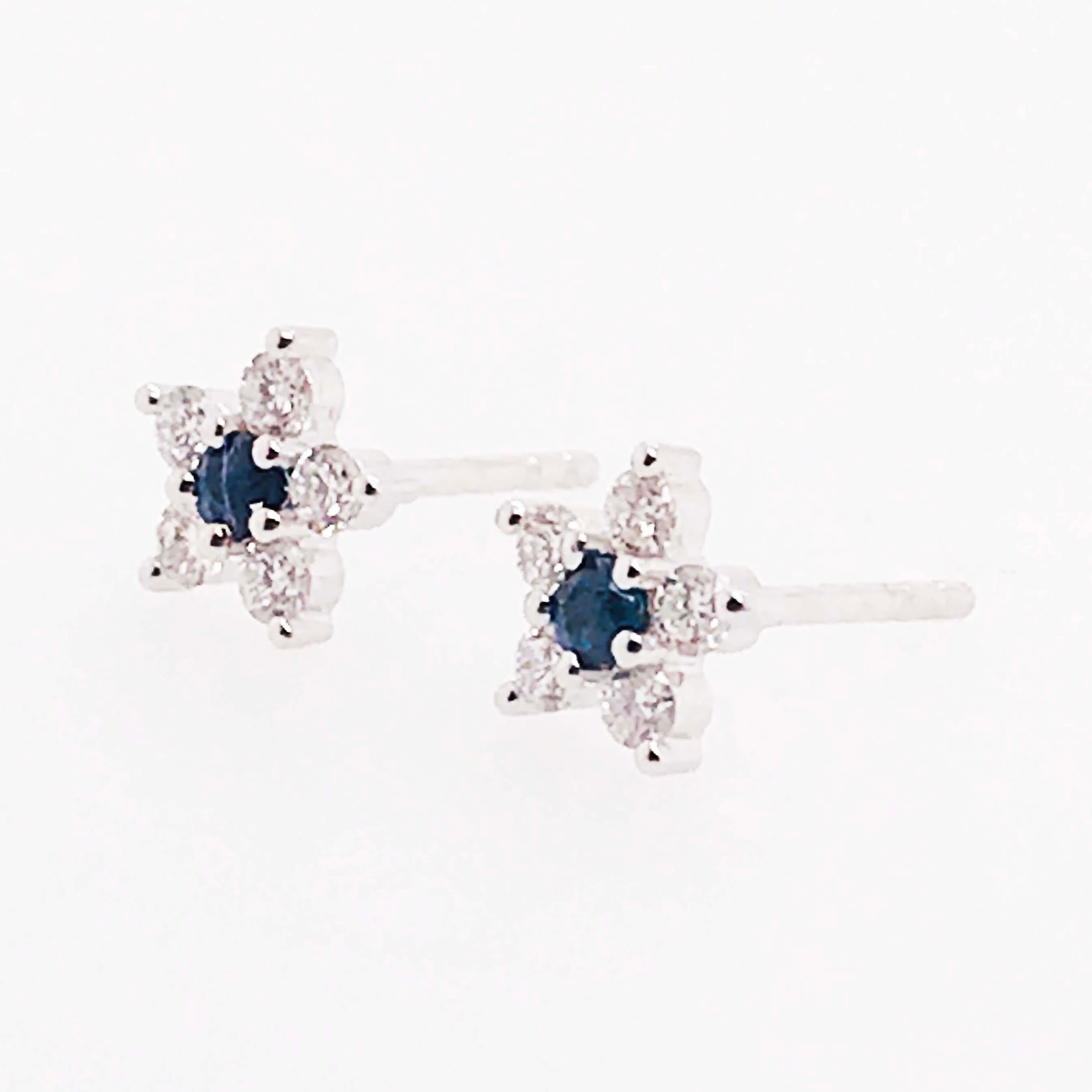 Adorable blue sapphire and diamond flower earring studs! With a genuine blue sapphire gemstones set in the center. The sapphire has a natural, deep blue color and has been cut in a round faceted shape that showcased the sapphires natural colors