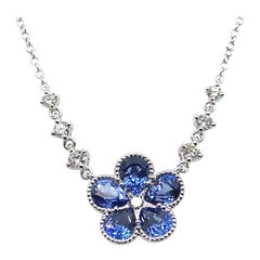 Sapphire and Diamond Flower Pendant in 18 Karat White Gold