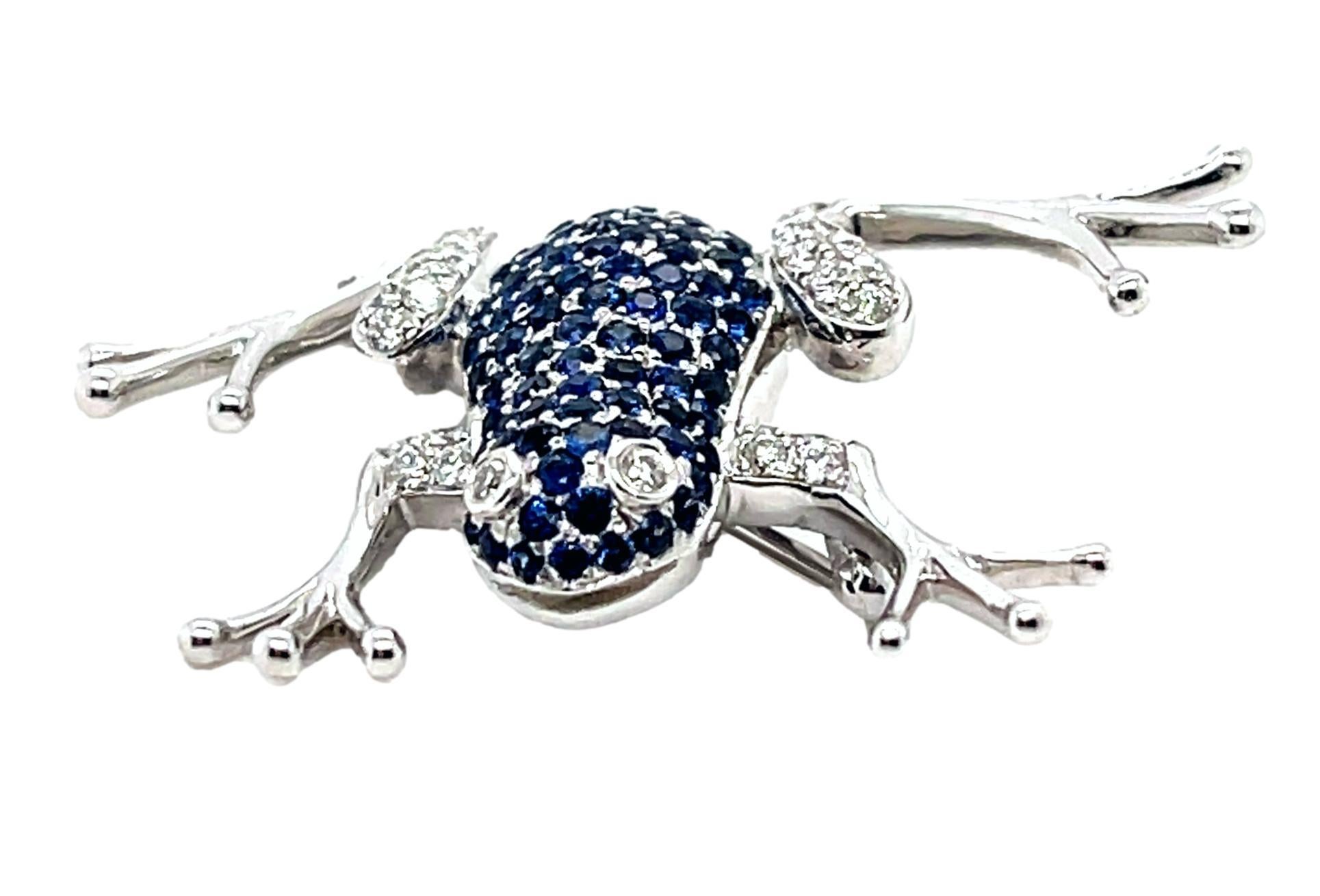 This stunning Frog Brooch is the perfect accent to wear at that cocktail event. It has one carat of top quality Sapphires along with sparkling diamonds all set in 18K white gold. It has a pull lock for extra security. This brooch comes in a