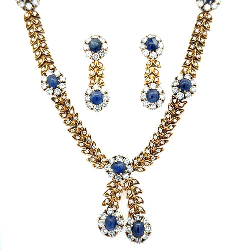 Simply Beautiful! Vintage Necklace and Earrings Set. Securely nestled Hand set with Cabochon Sapphires, weighing approx. 17tcw and Round Brilliant Cut Diamonds, approx. 15.00tcw. High Quality 18K Yellow Gold Leaf Links design mountings. Manifique!